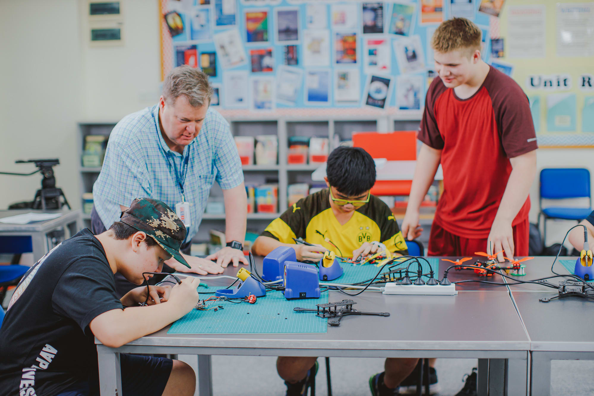 AISG Robotics teacher guiding students