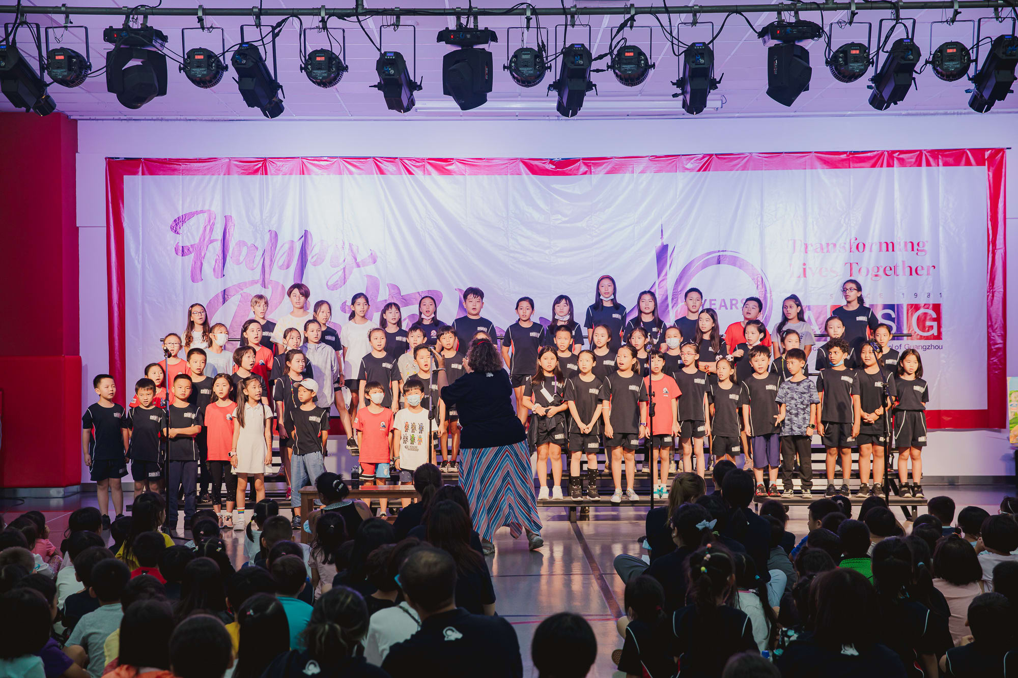 At AISG's 40th birthday celebration, elementary choir students sang 2 songs for AISG