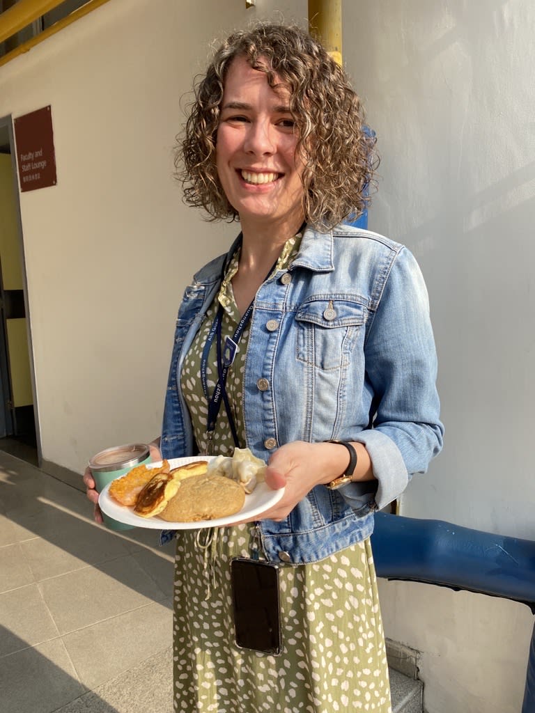 AISG celebrates Teacher Appreciation Week with a teacher with her plate of snacks