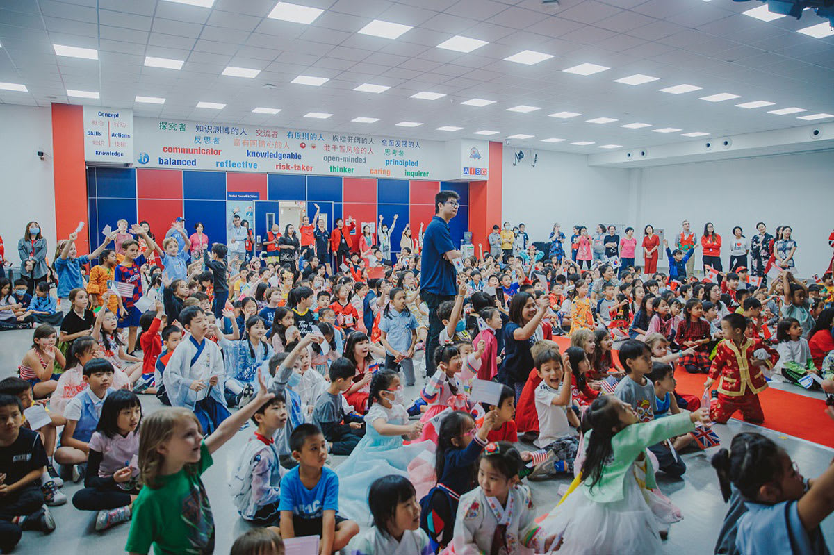 elementary students gathered together to celebrate UN day
