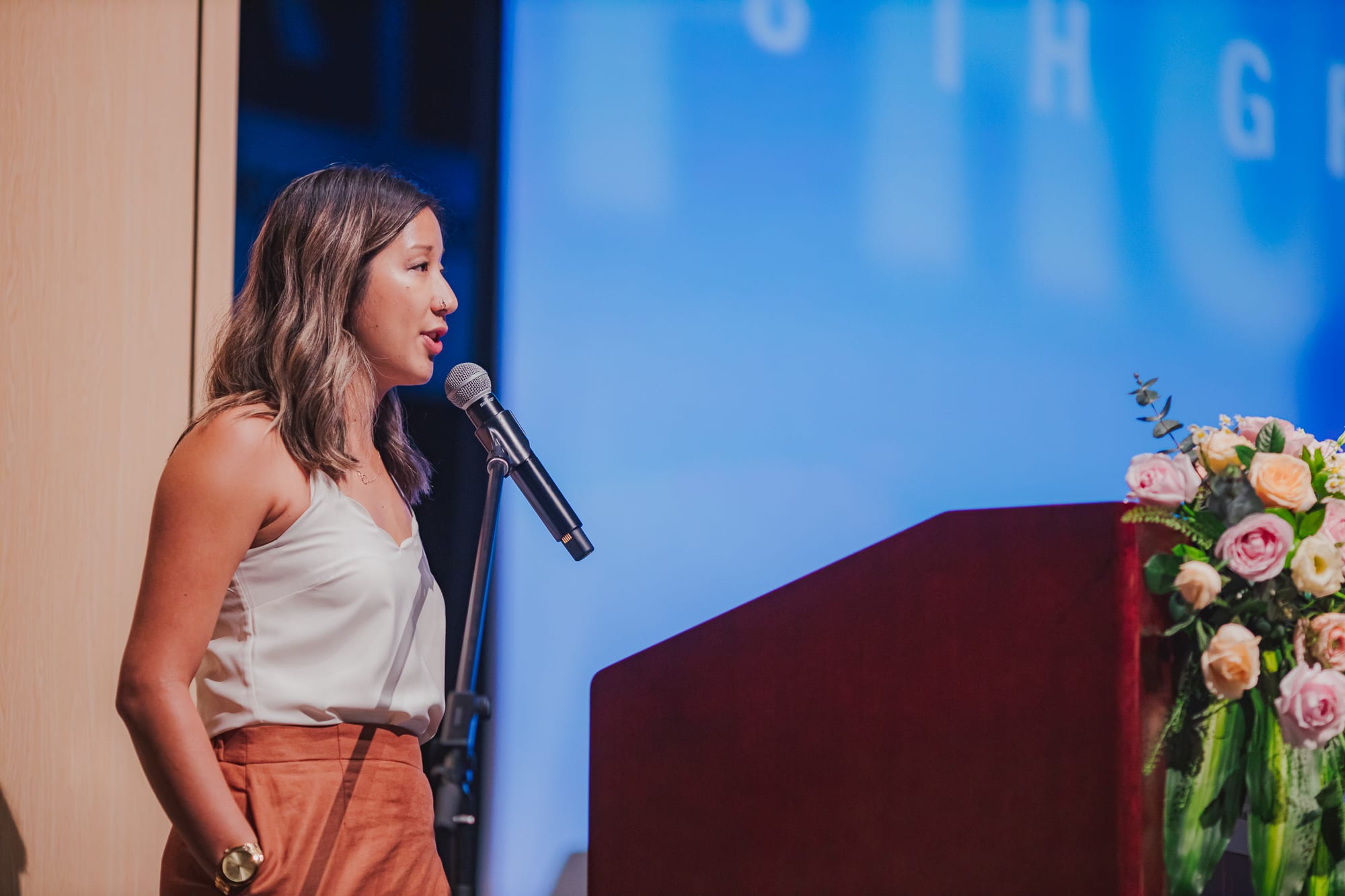 AISG Grade 8 Promotion teacher gives speech onstage