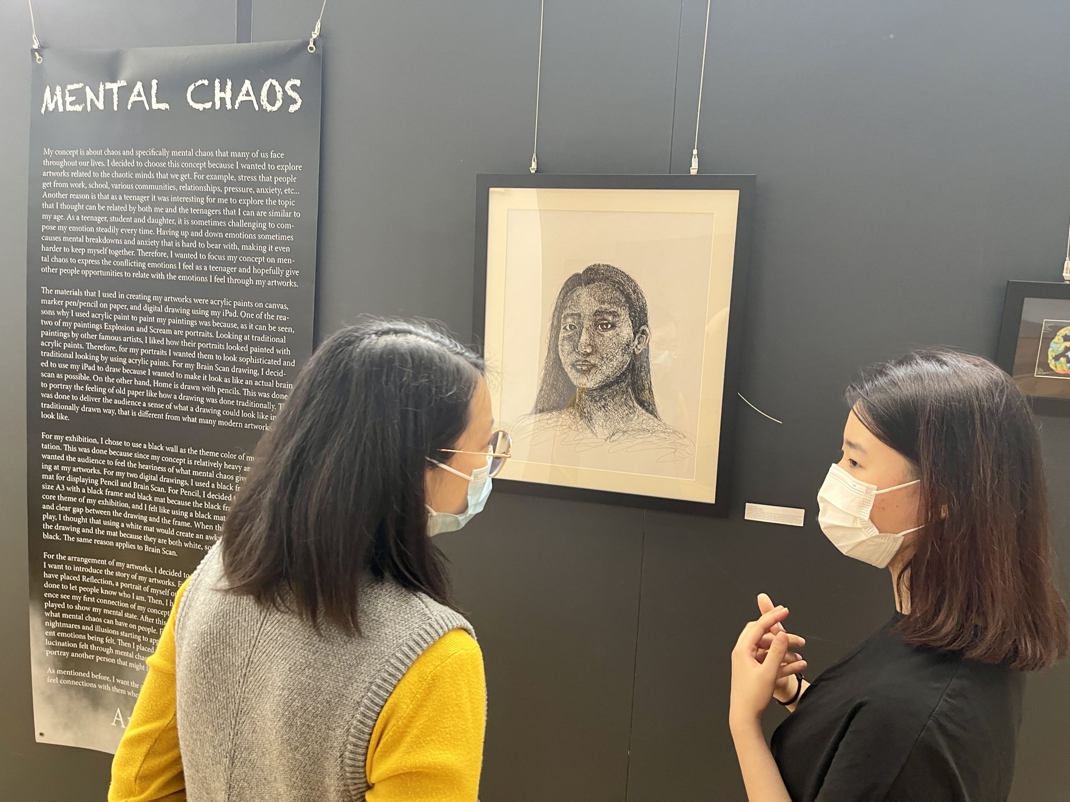 AISG IB Visual Art senior explaining her art to an audience