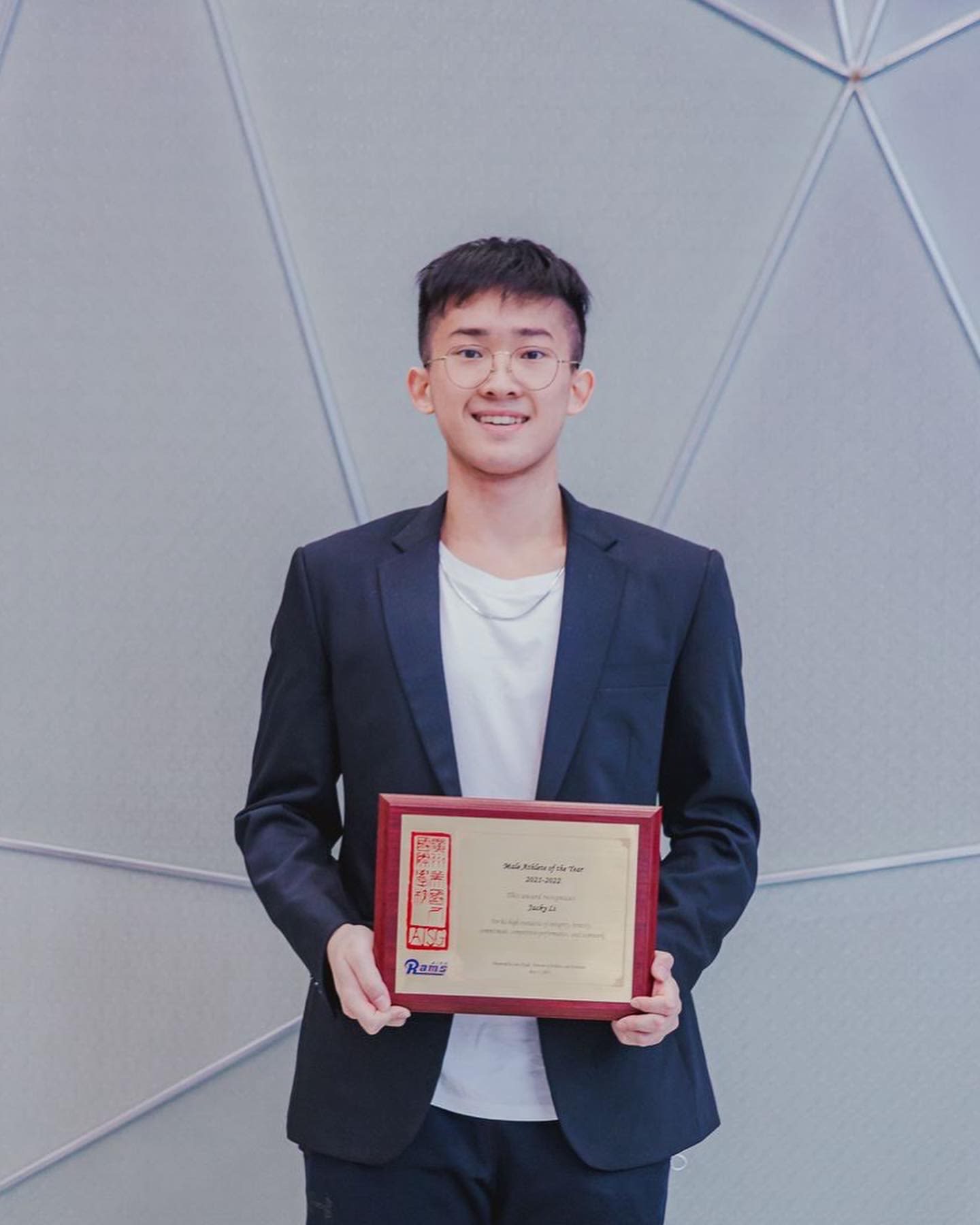 AISG senior athlete showing his Scott Mohr award