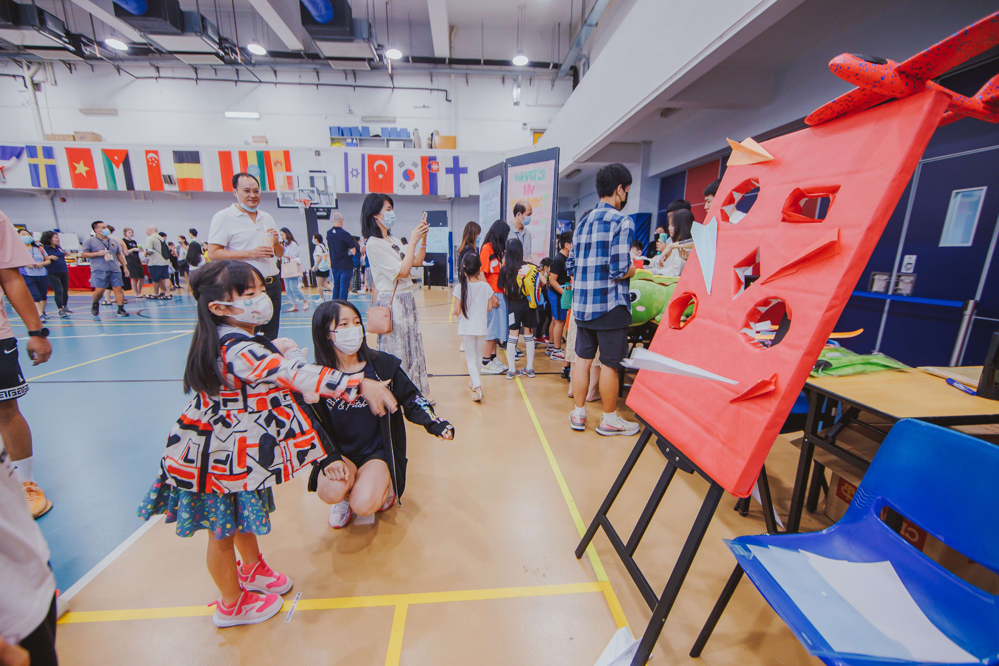 AISG Family Fun Day for SY2122 with students playing ball toss