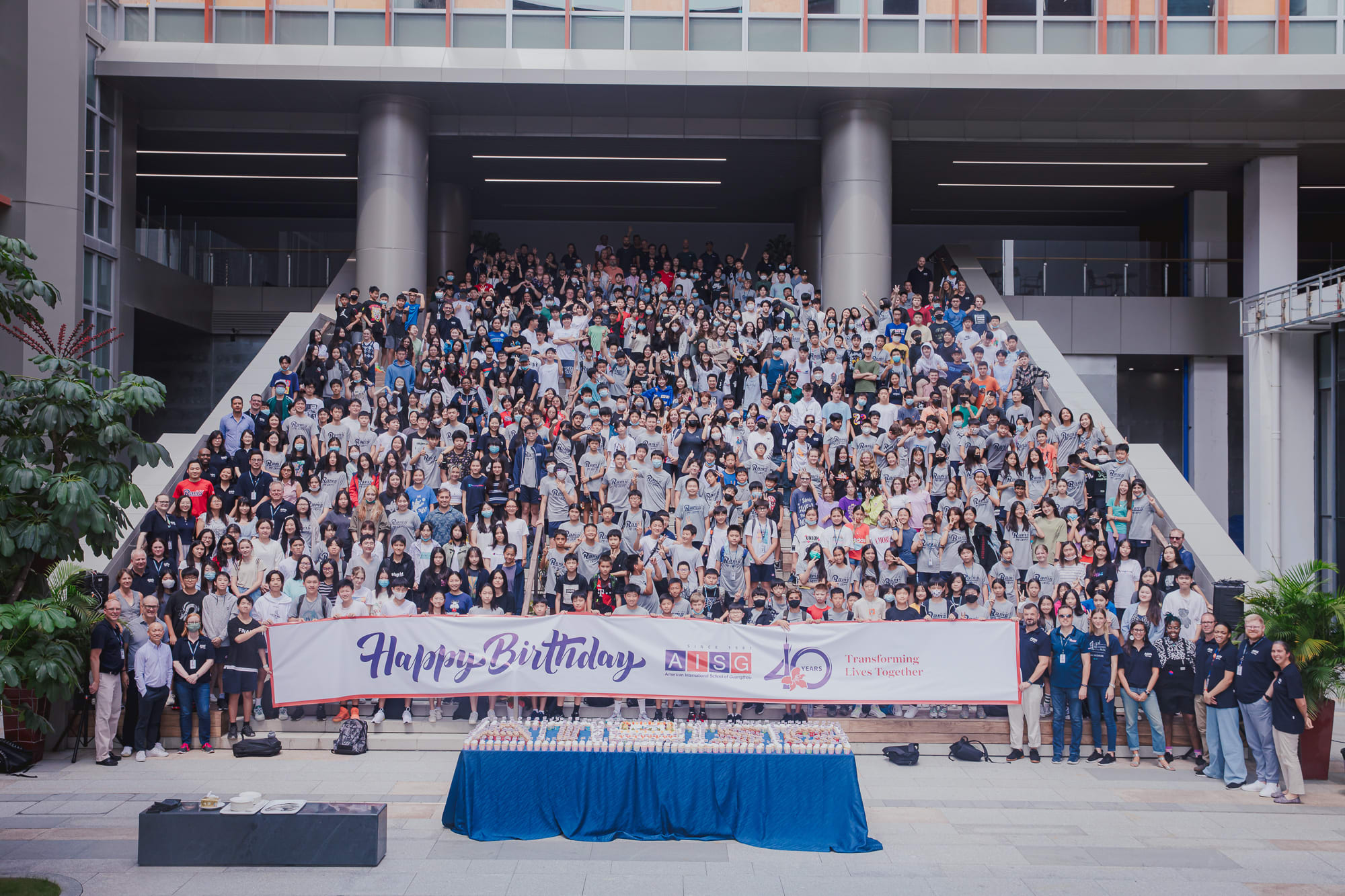 At AISG's 40th birthday celebration, students and faculty take a big group photo at Science Park