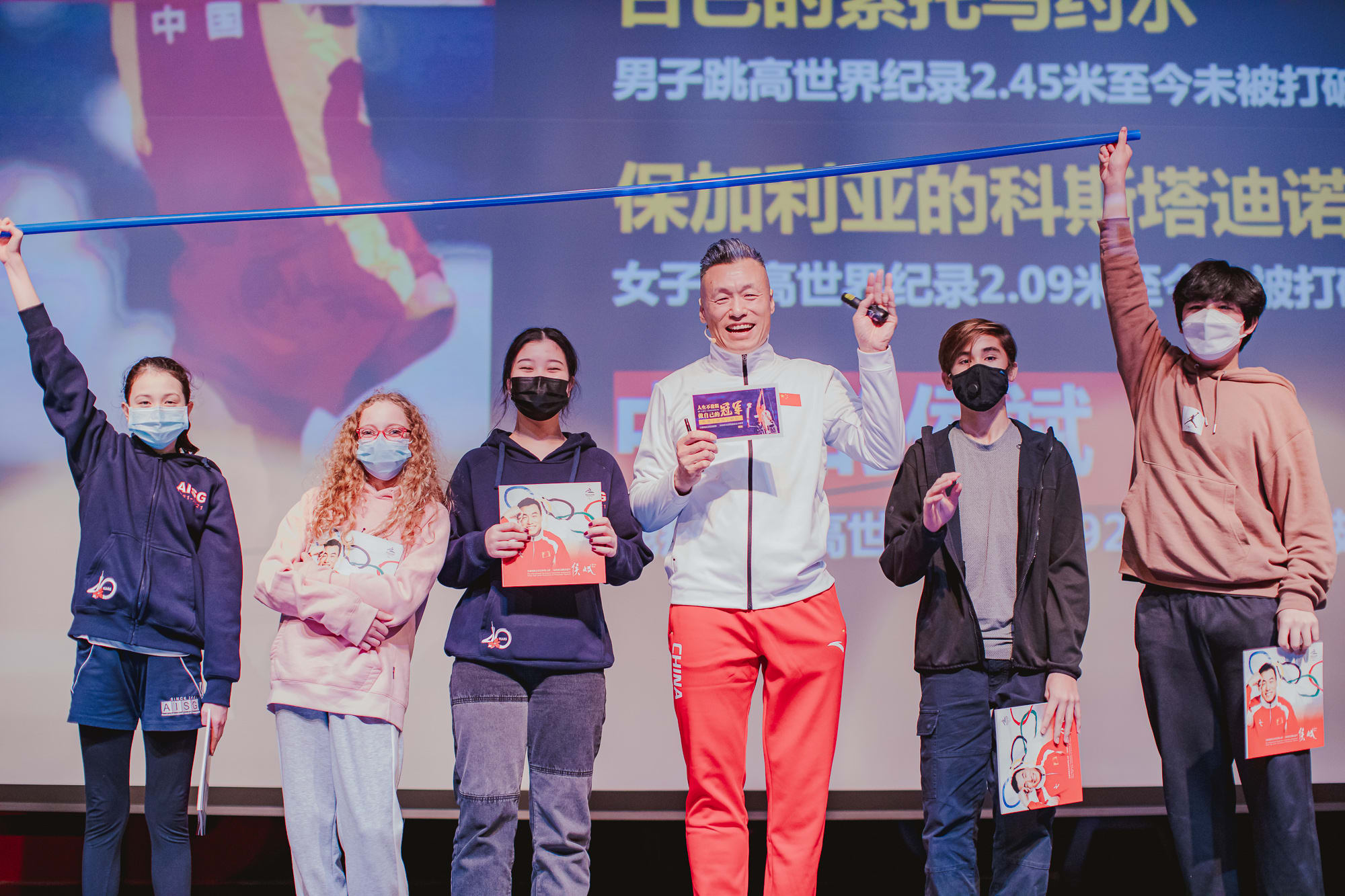 AISG Speaker Series with Hou Bin with volunteers from secondary school on stage