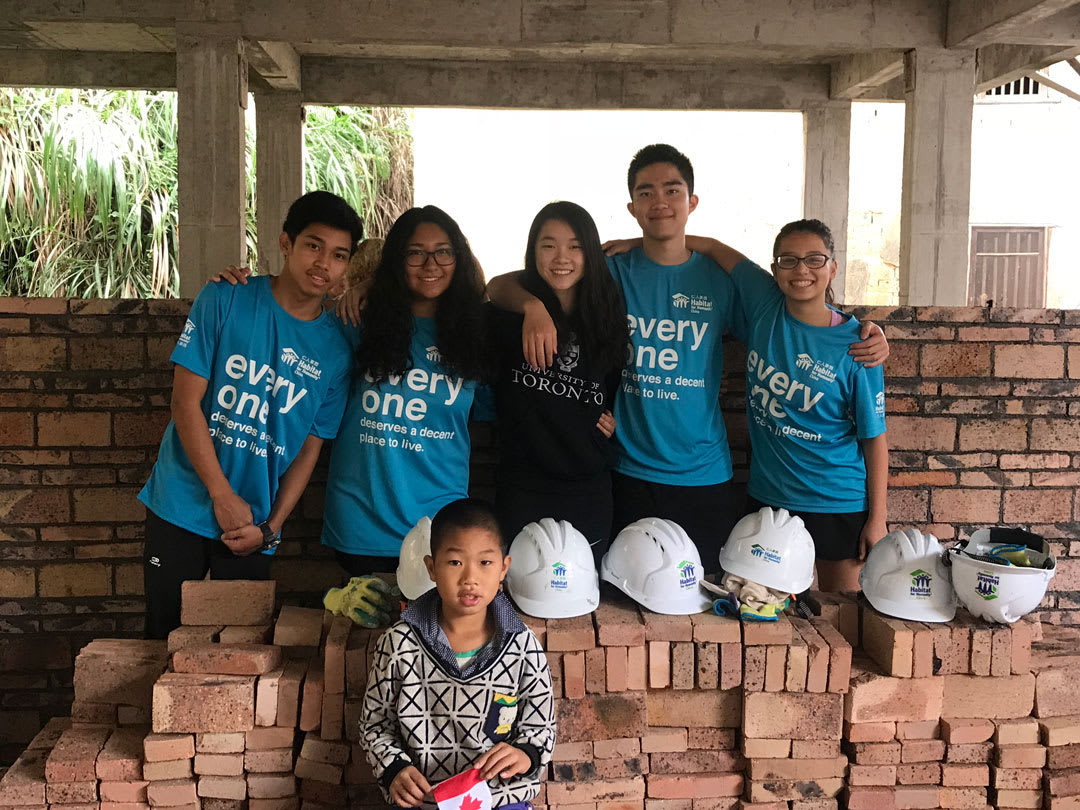 picture of some AISG students on location while on a service project 