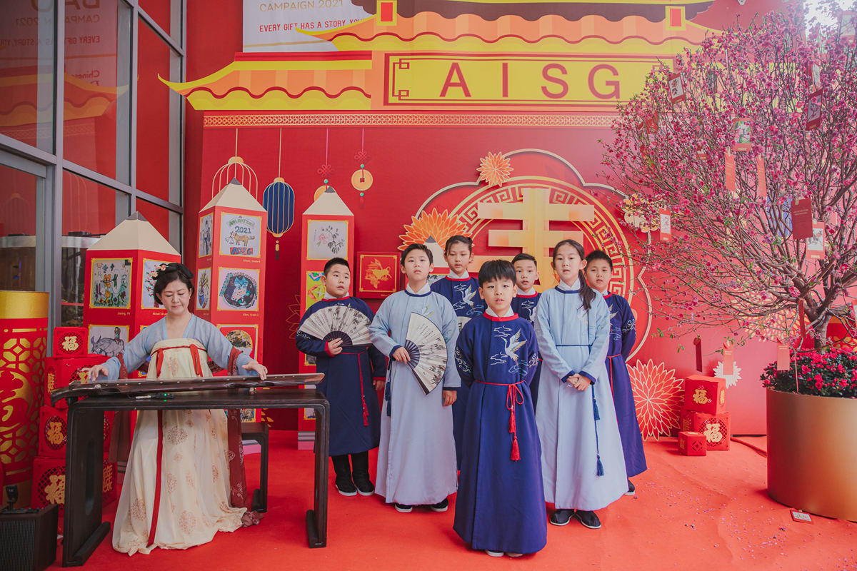 a group of student sings during the hongbao celebration