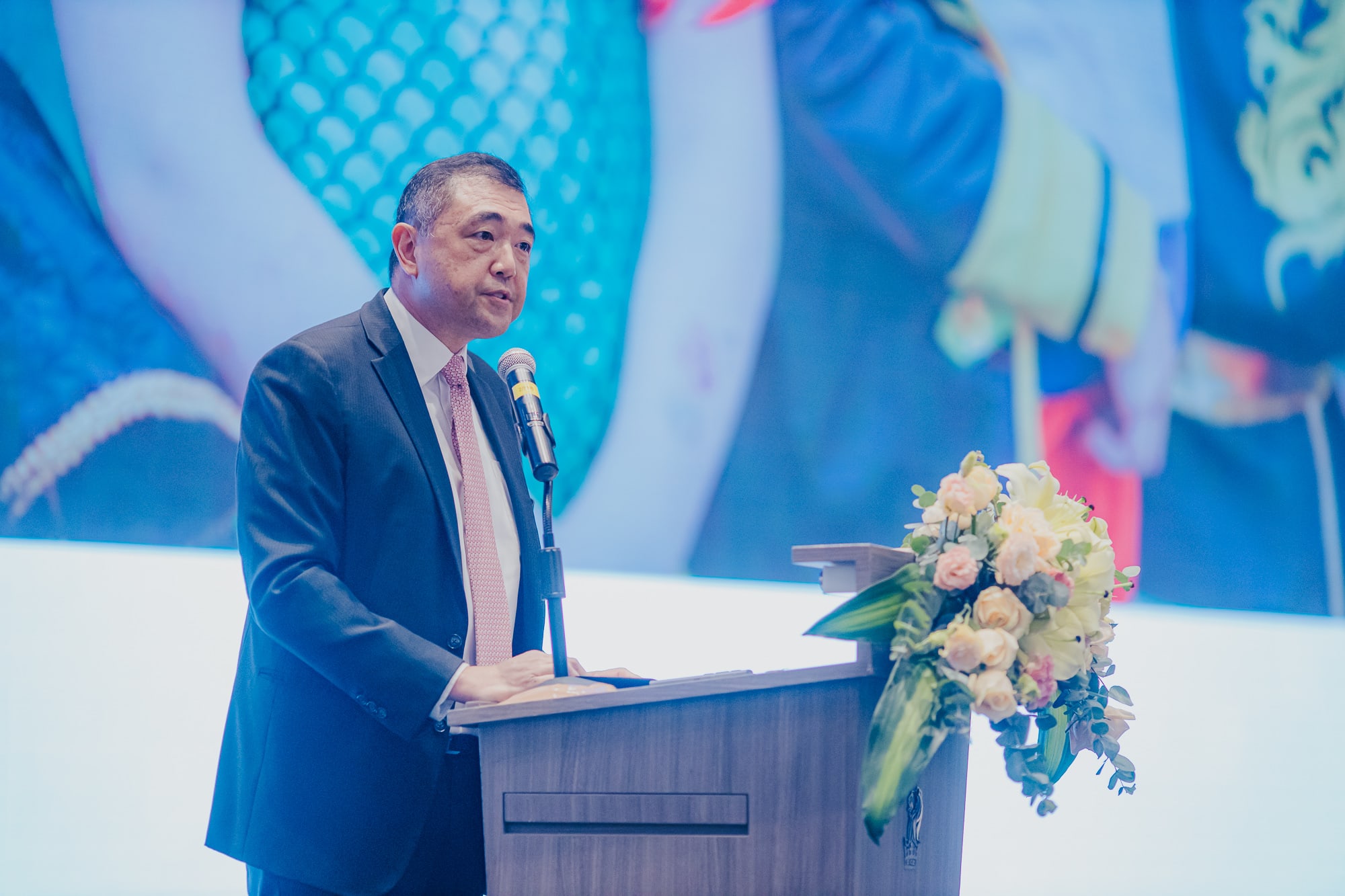 man talking at podium