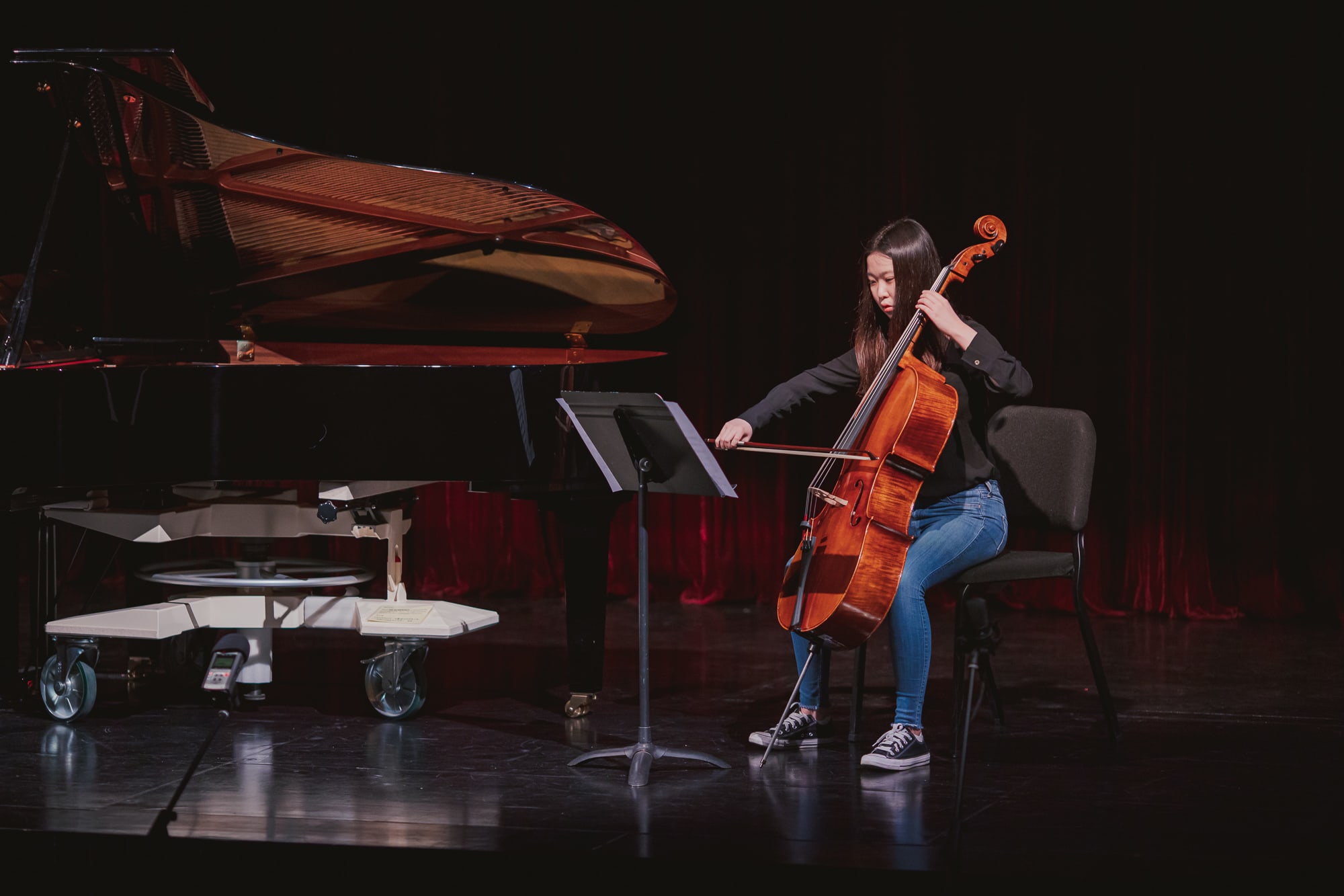 An AISG senior student playing the cello for the International Baccalaureate (IB) Music Recital