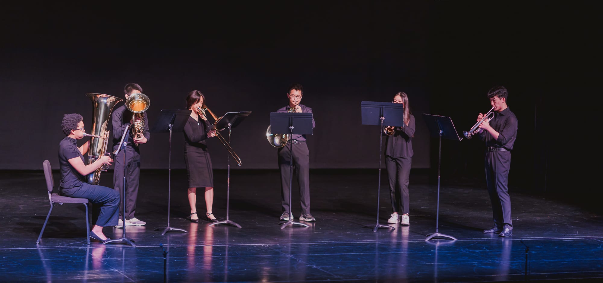 AISG Athletics & Activities Awards Ceremony with students performing brass instruments