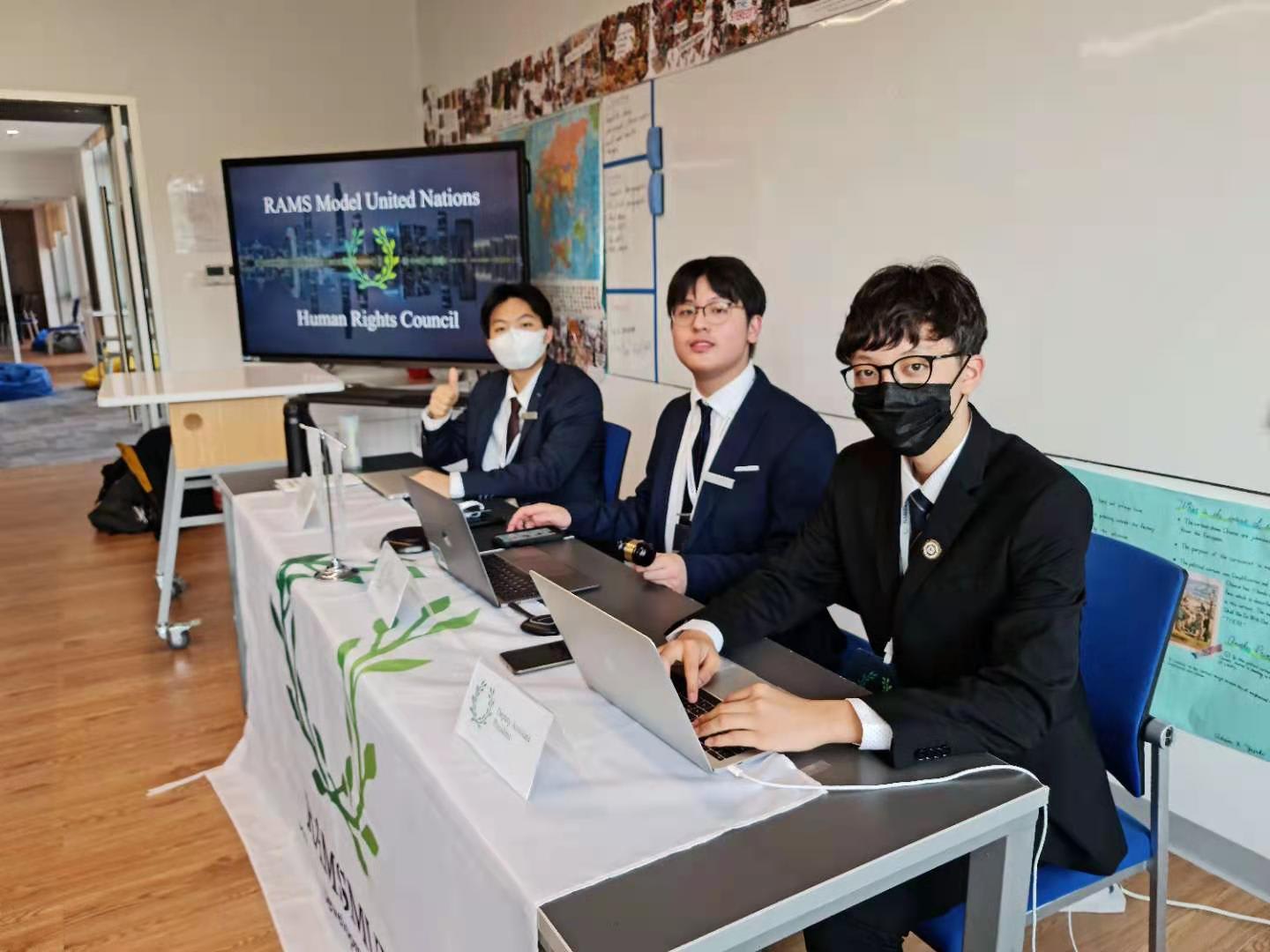 AISG MUN three students