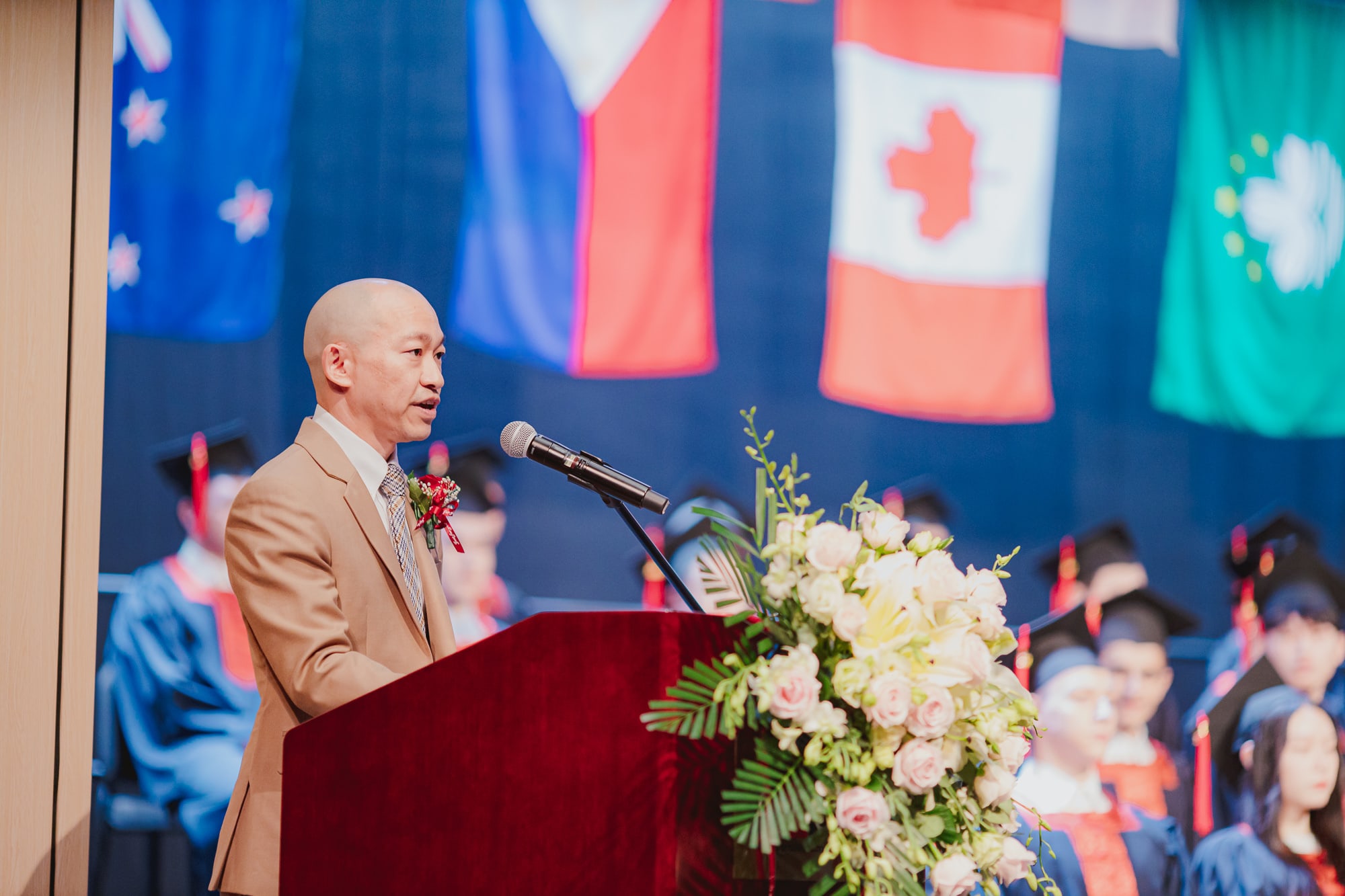 man giving speech onstage