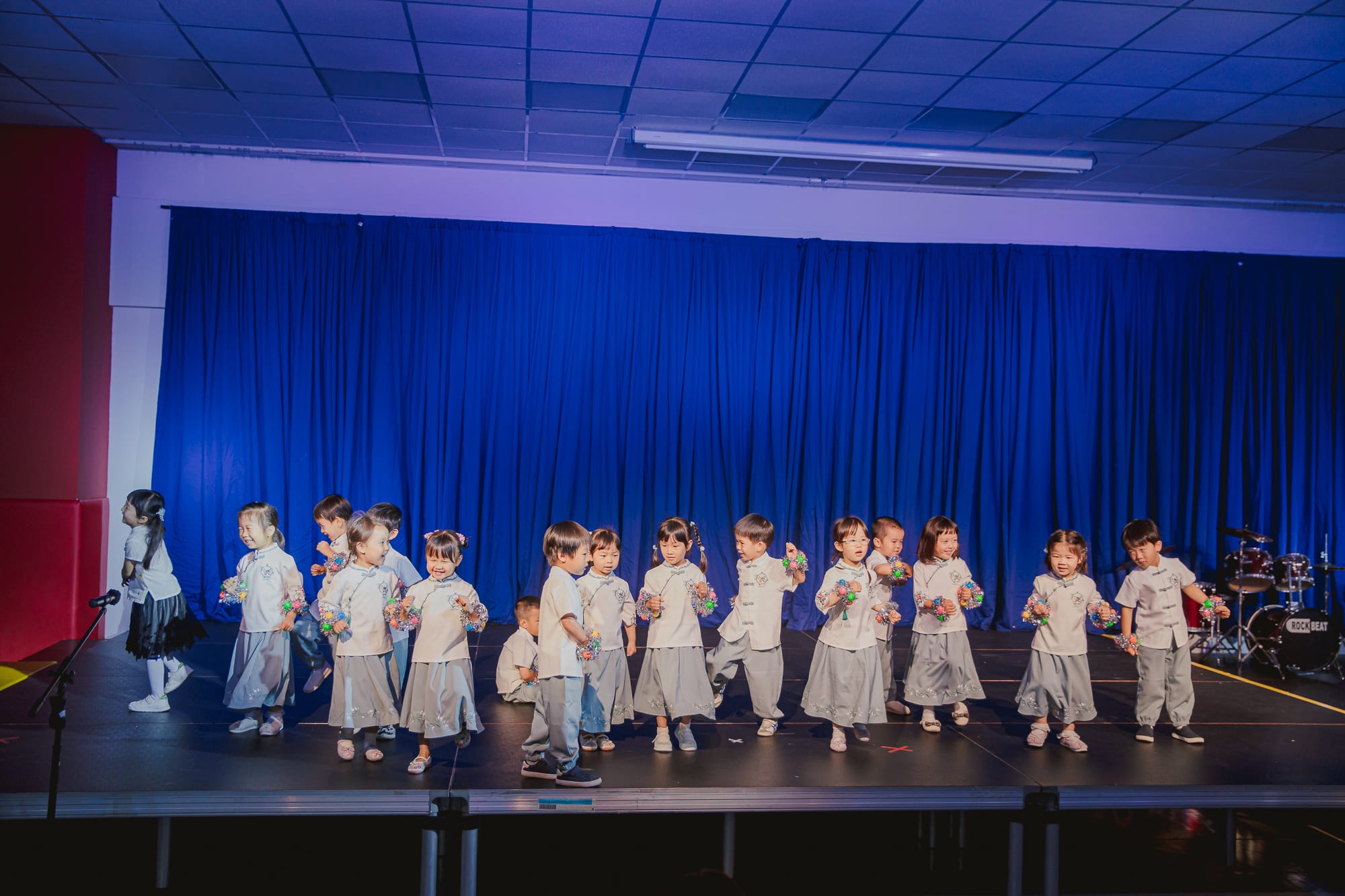 children on stage performing