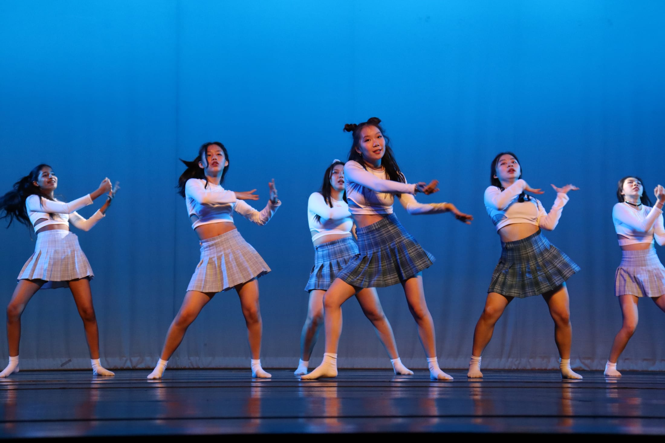 AISG at APAC in Shanghai with dancers in blue light background