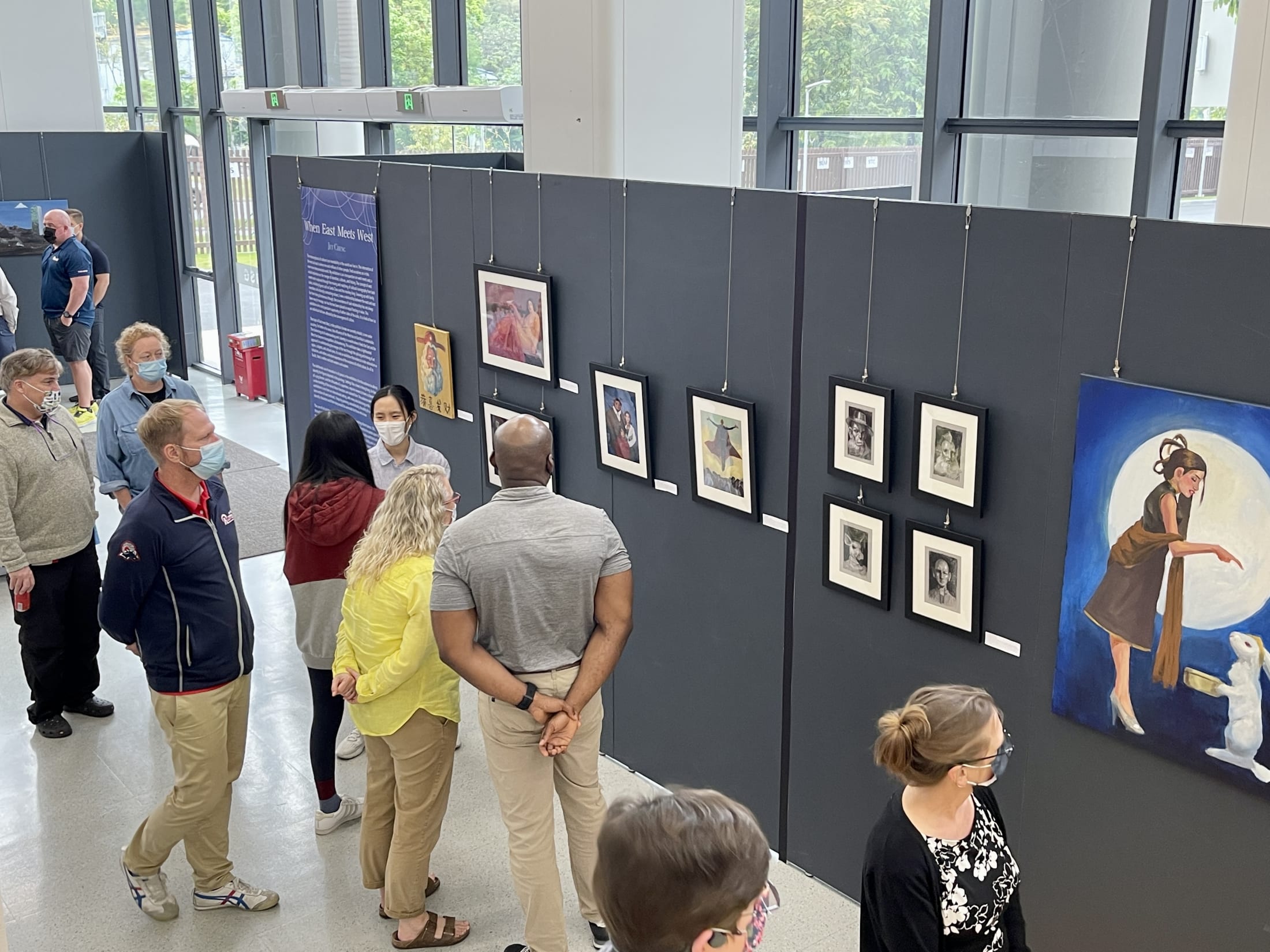AISG IB Visual Art Exhibit with the crowd appreciating the art