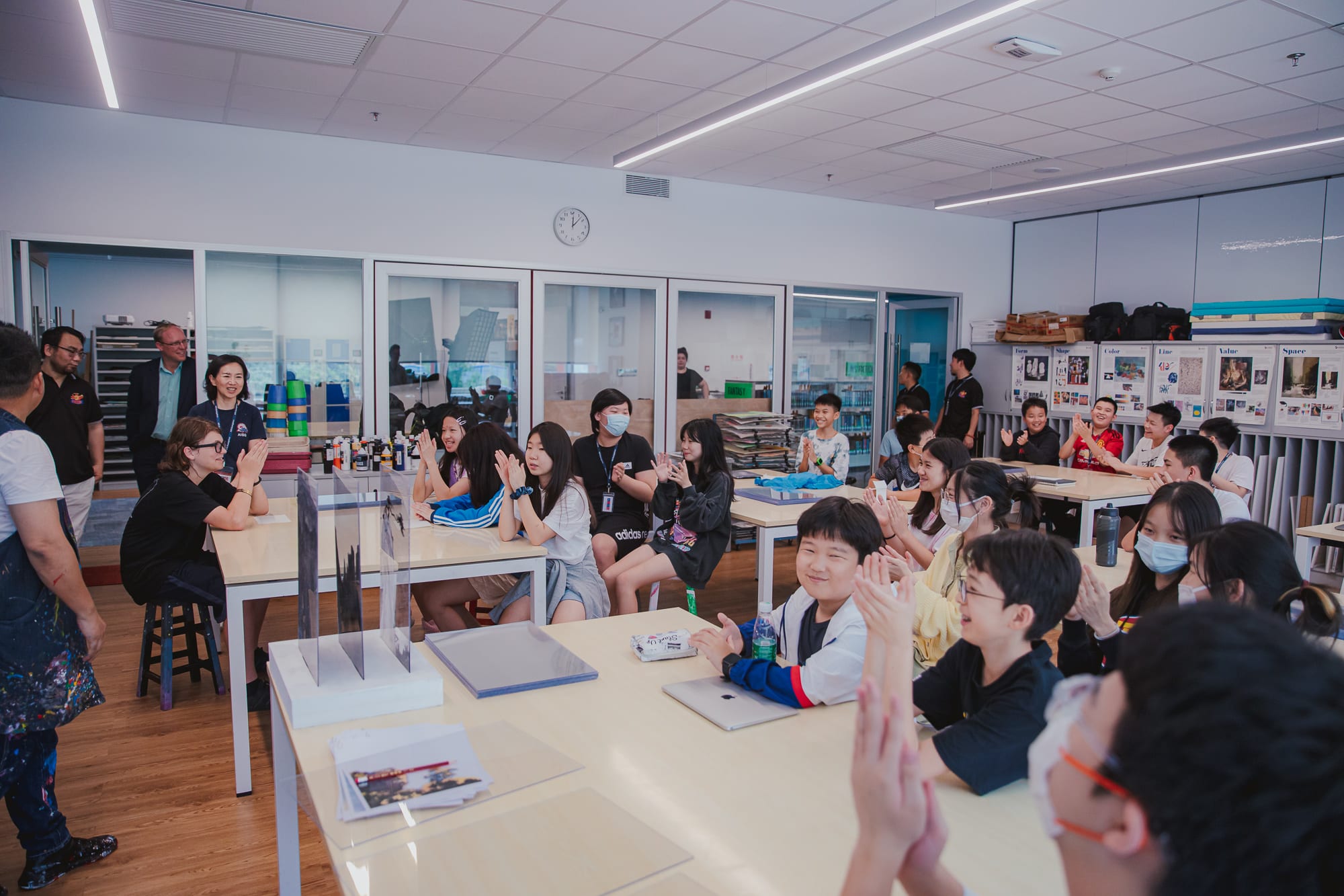 students clapping