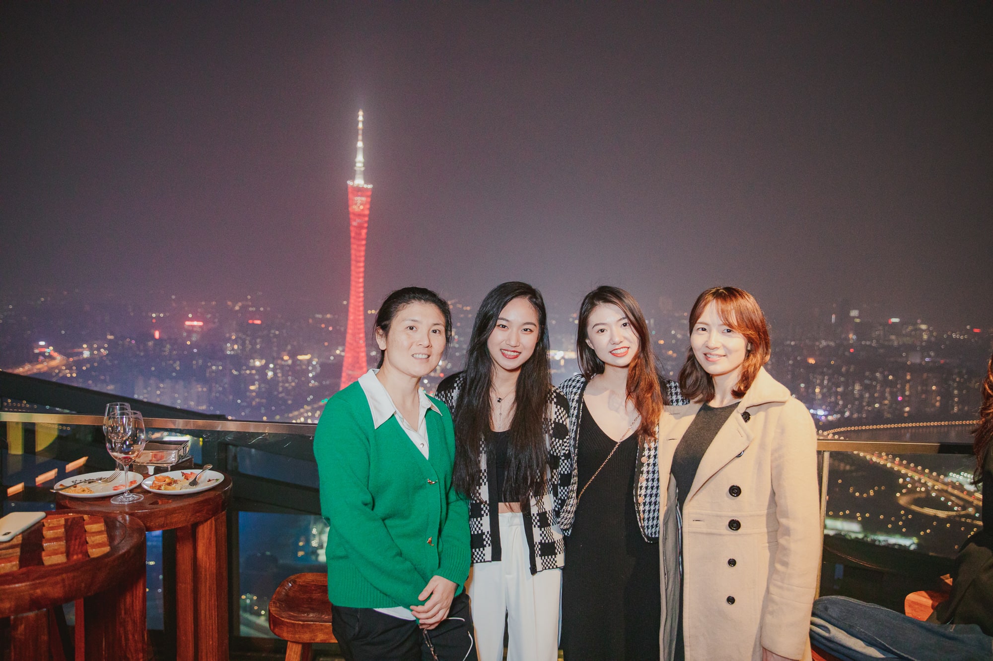 AISG alumni with AISG faculty in an alumni Ram Gathering event with Canton Tower in the background