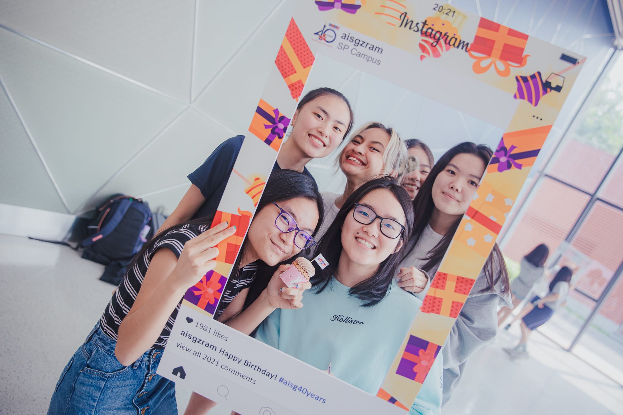 AISG's 40th birthday celebration with Secondary students taking photos in instagram booths at Science Park
