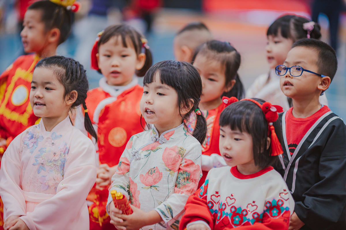 young students singing at CNY
