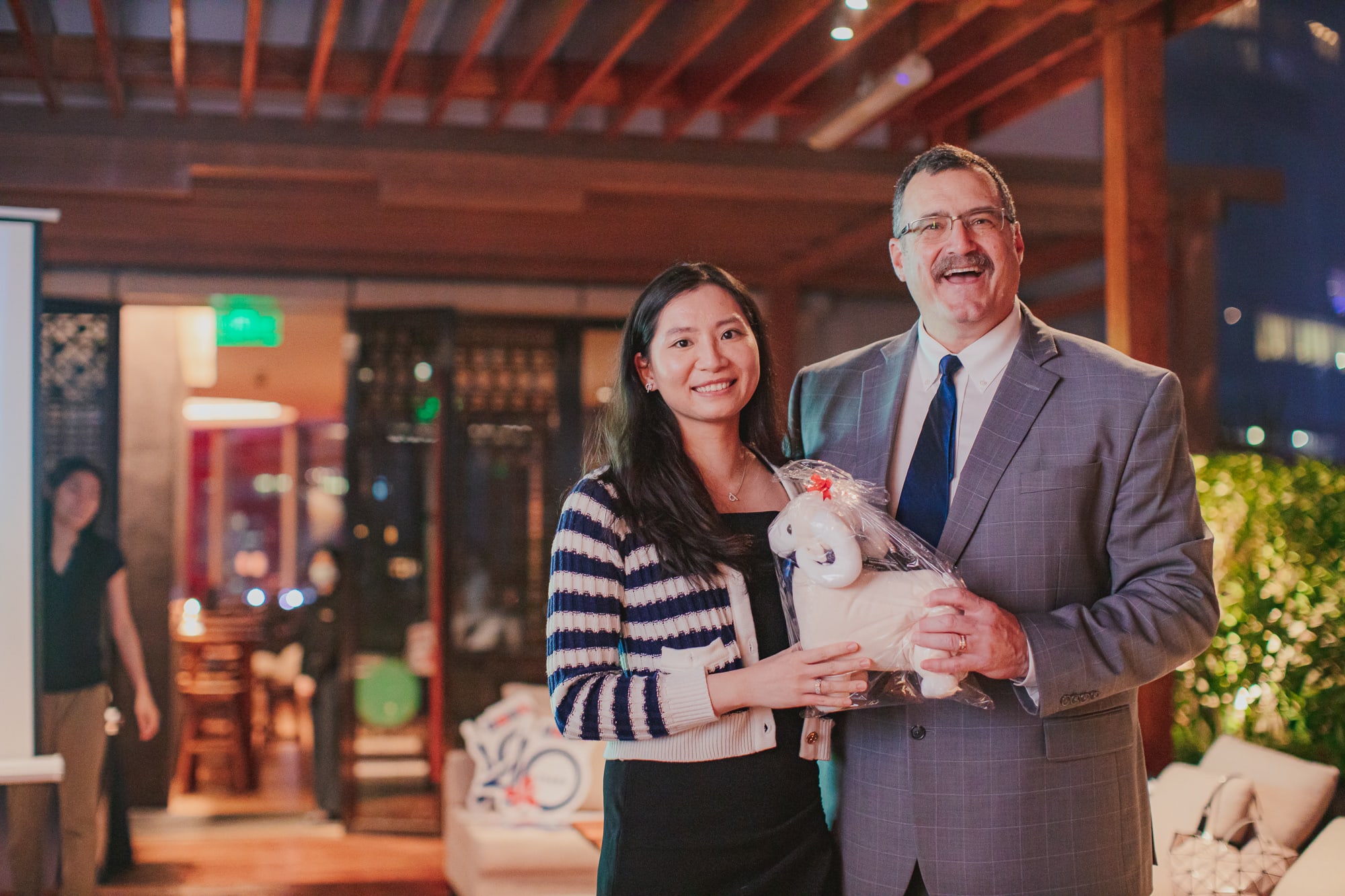 AISG alumni winner of lucky draw of Ram stuffed animal at the alumni Ram Gathering event