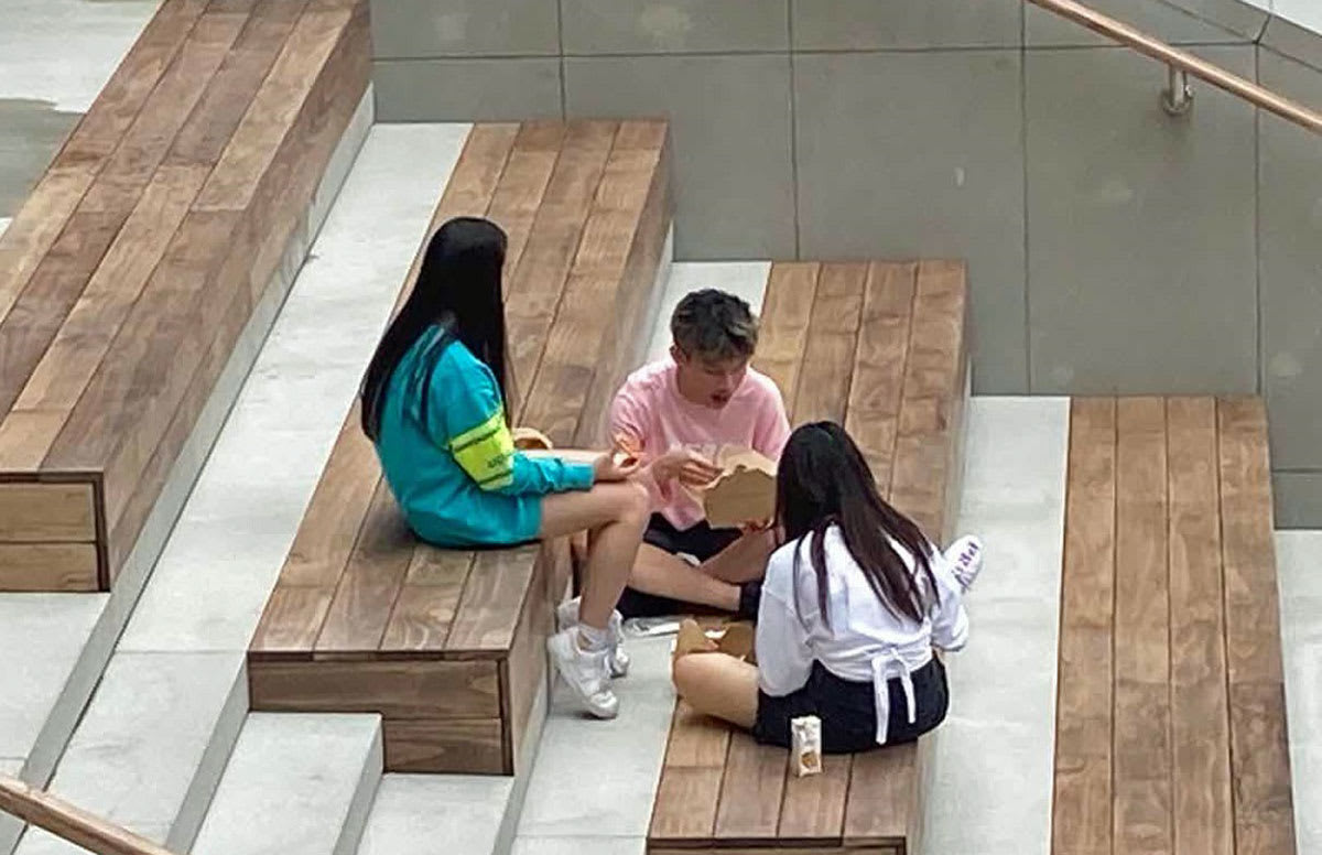 picture of students sitting on the grand staircase in Science Park