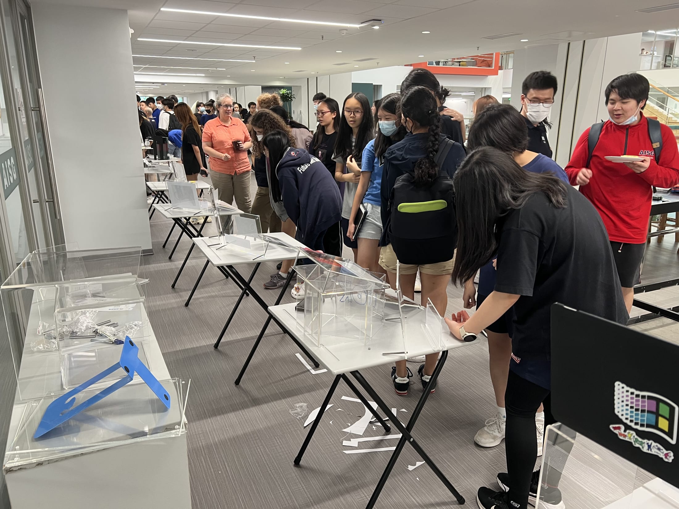 AISG TOK Exhibition with a row of tables for students' exhibitions