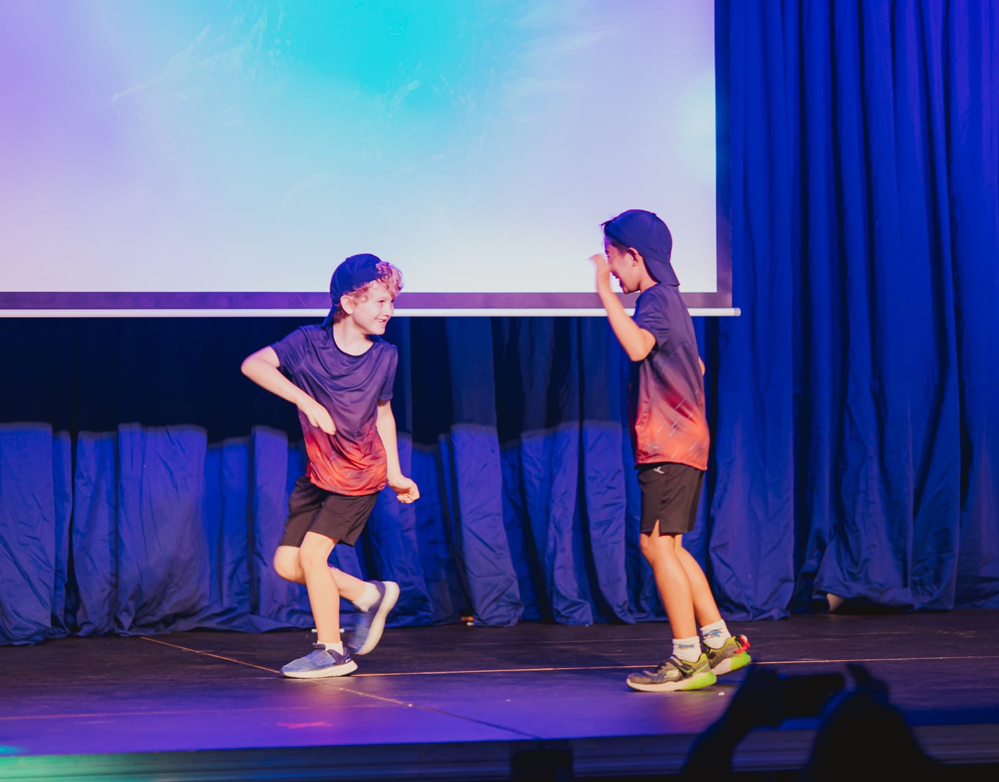 two boys dancing onstage