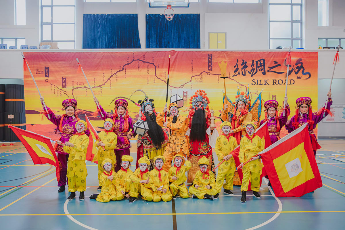 dressed in costumes students are performing during the culture celebration