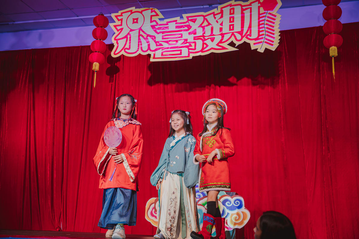 three girls dressed in costumes celebrating the silk road