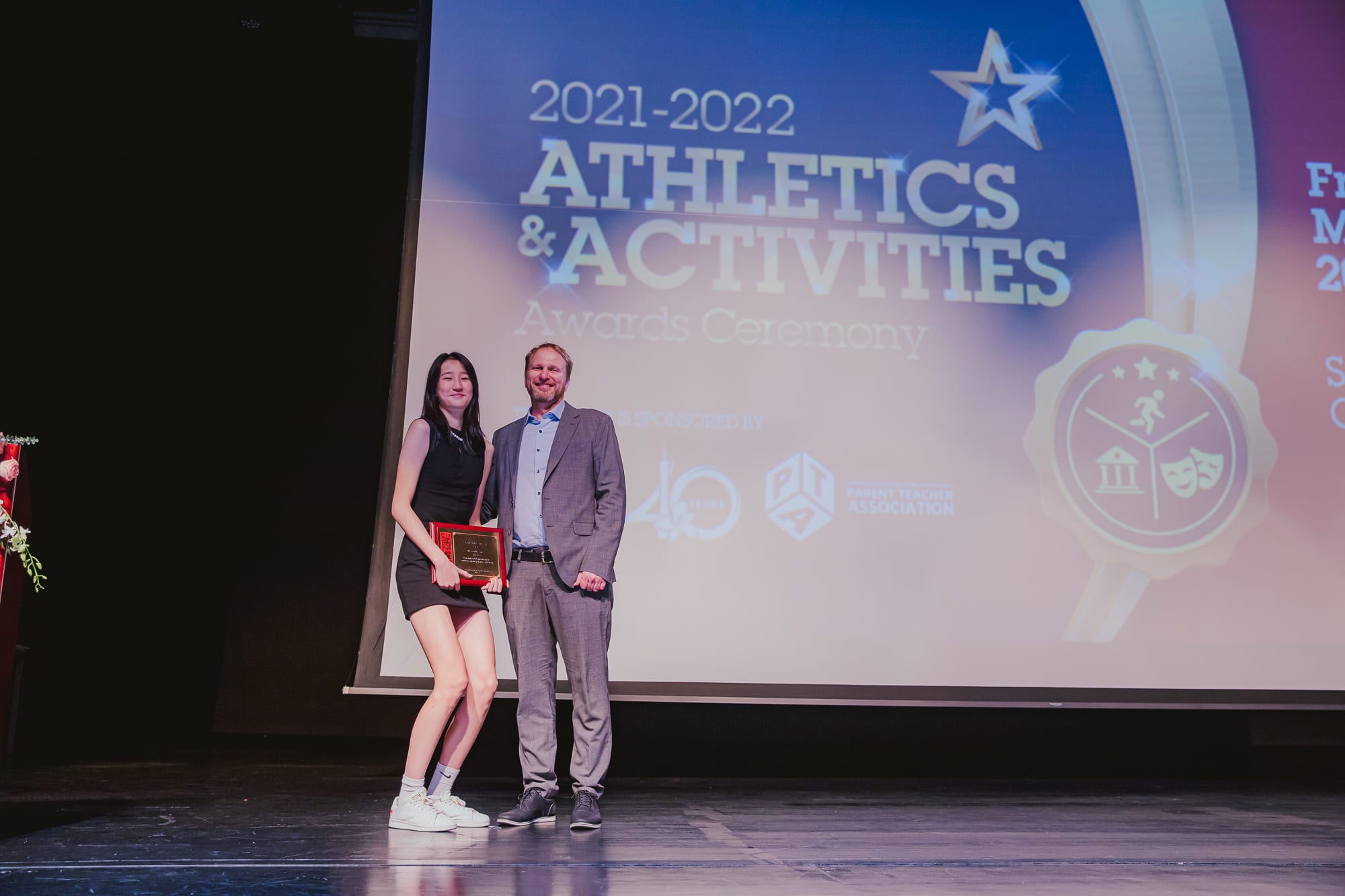 AISG Athletics & Activities Awards Ceremony presenting female athlete of the year award