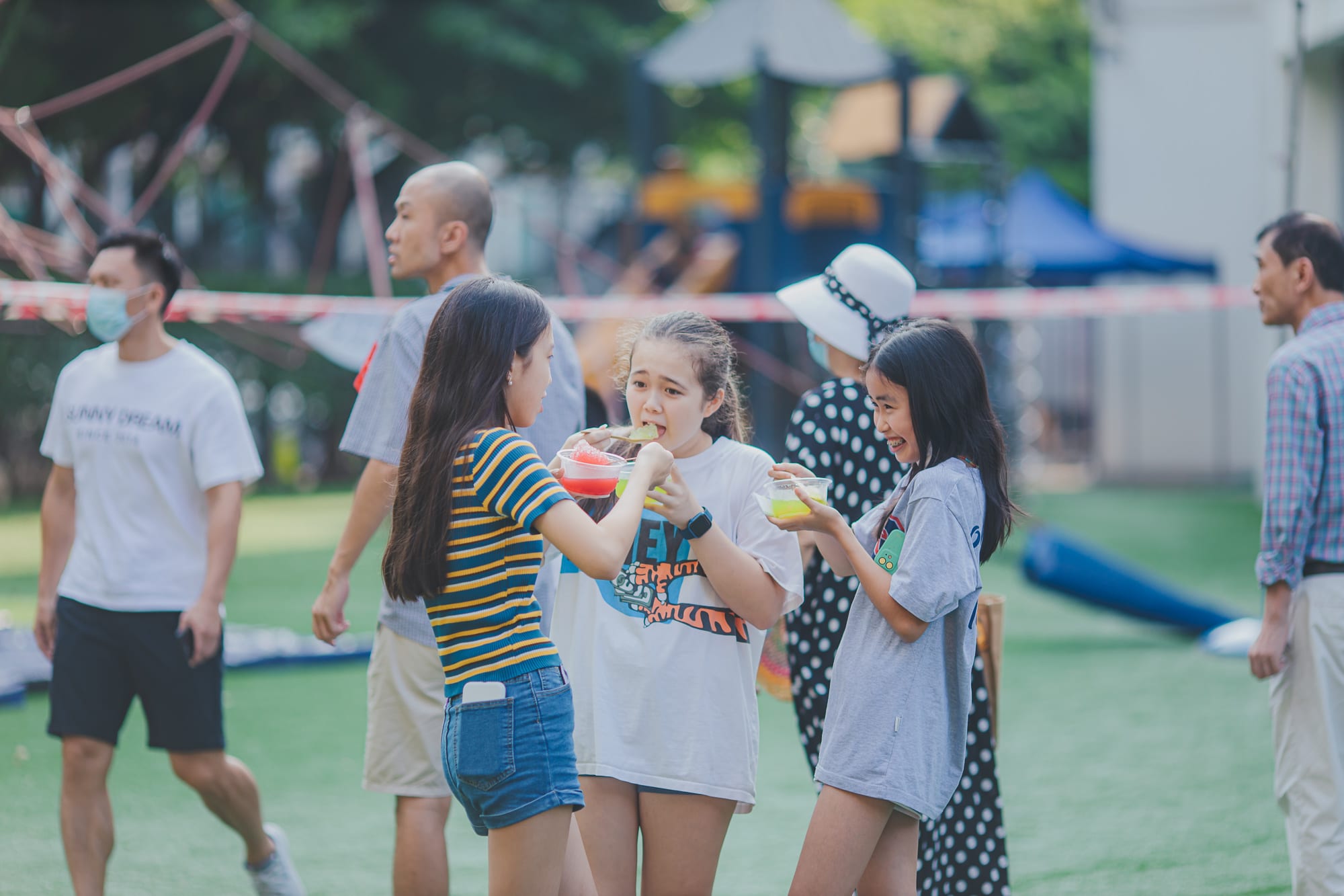 aisg family fun day girls eating slushies