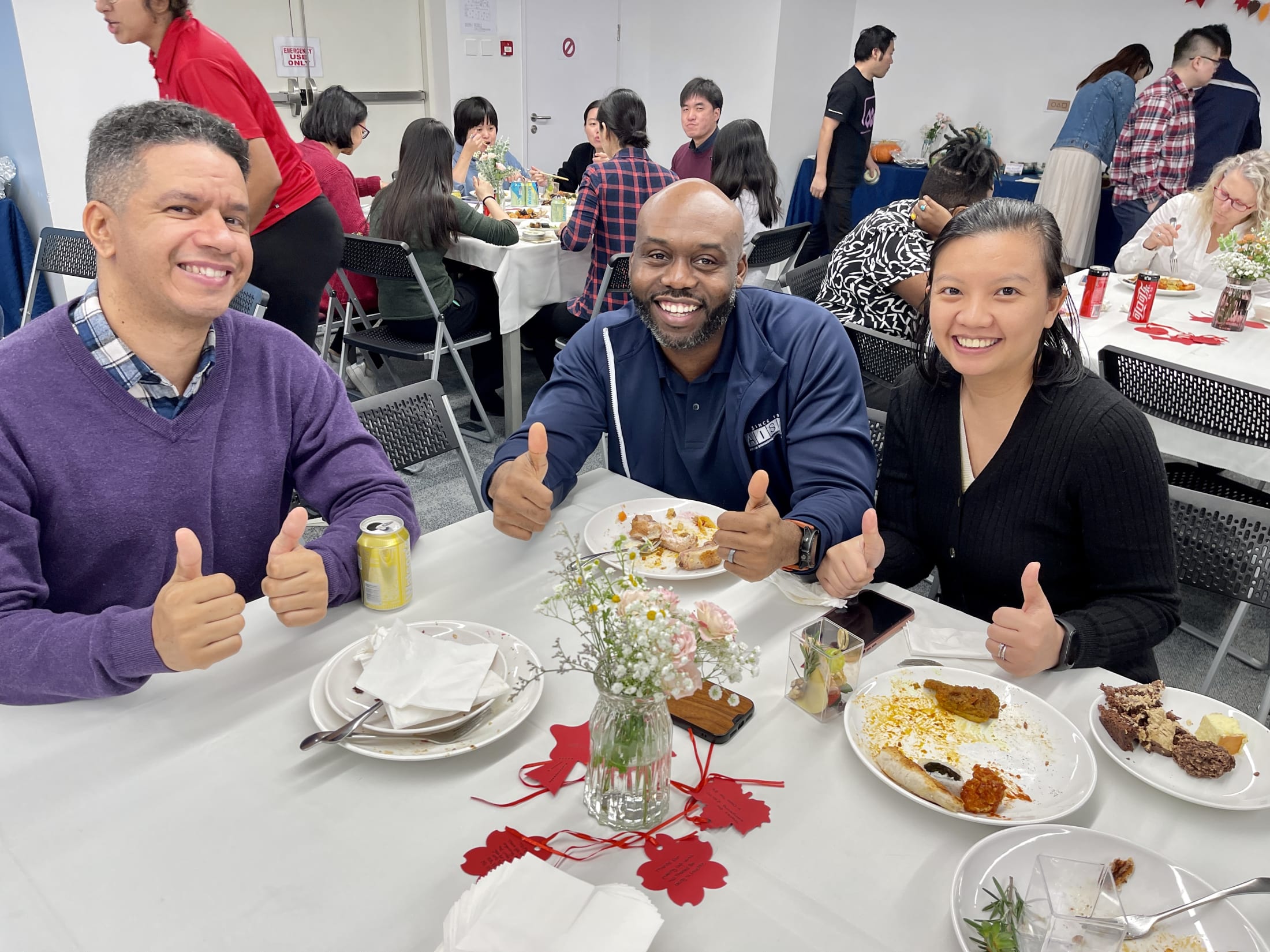 Faculty finishing their plates at the PTA Appreciation Lunch for AISG Faculty & Staff