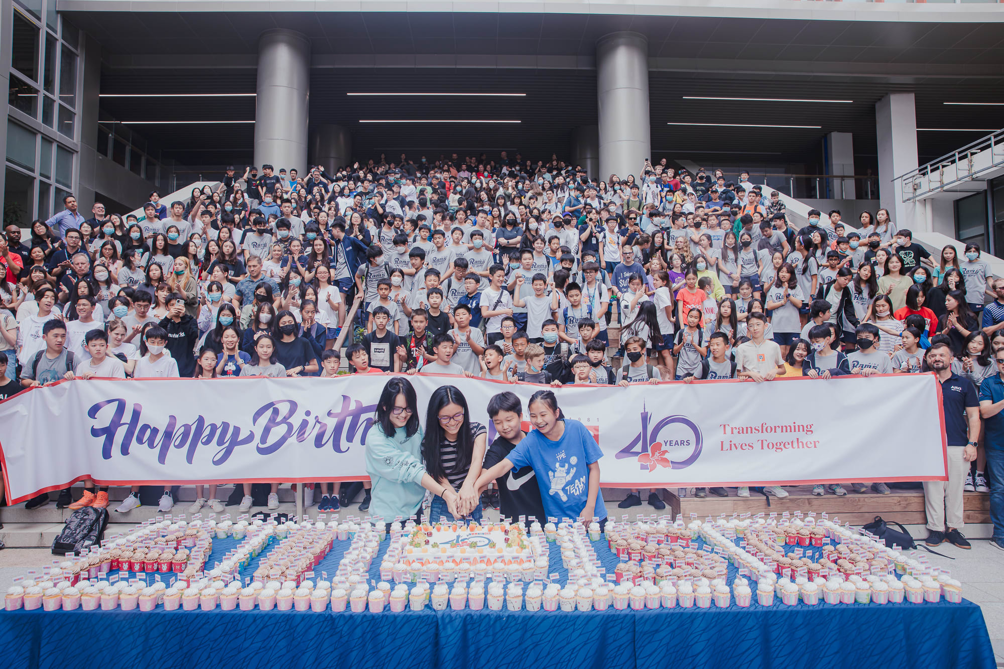 At AISG's 40th birthday celebration, reps from Secondary School student council cut the cake at Science Park