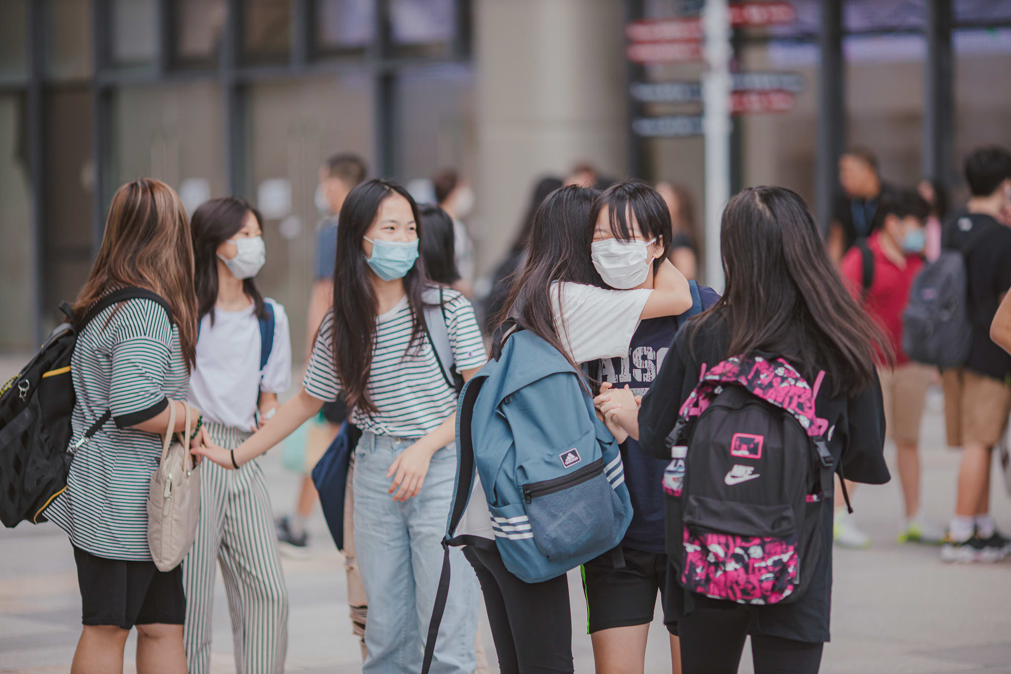 AISG welcome back secondary students hugging