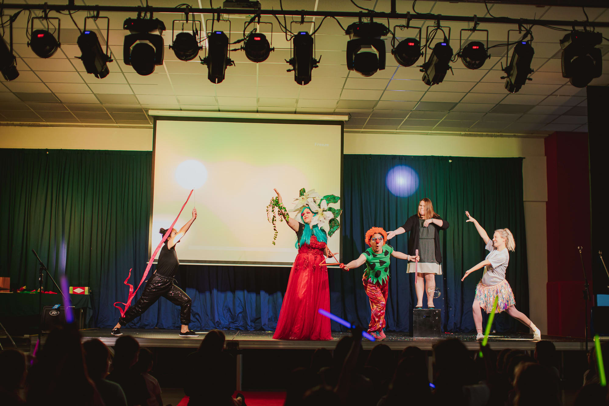 people in costumes performing onstage