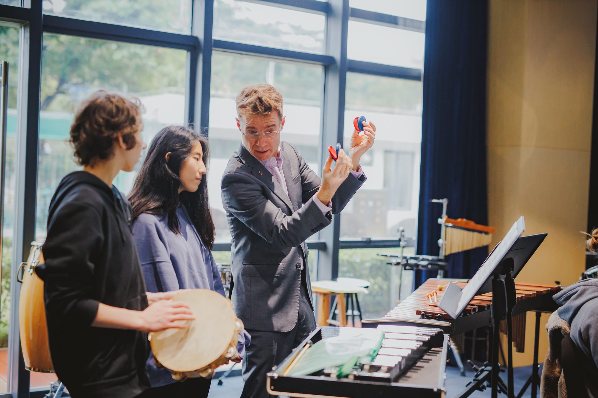 Dr. Scott Jones of Ohio State University working with band students at the American International School of Guangzhou AISG in