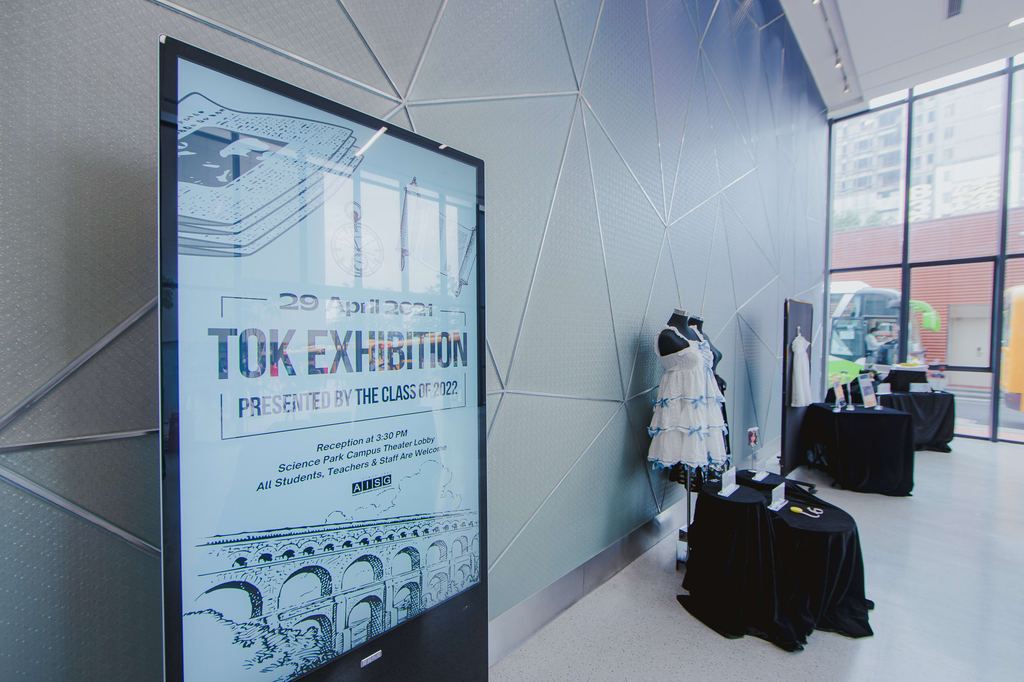 sign on screen and dress with table