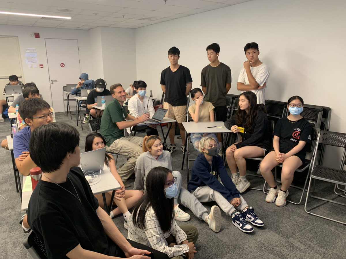 AISG College Counselor sitting with Juniors and Seniors