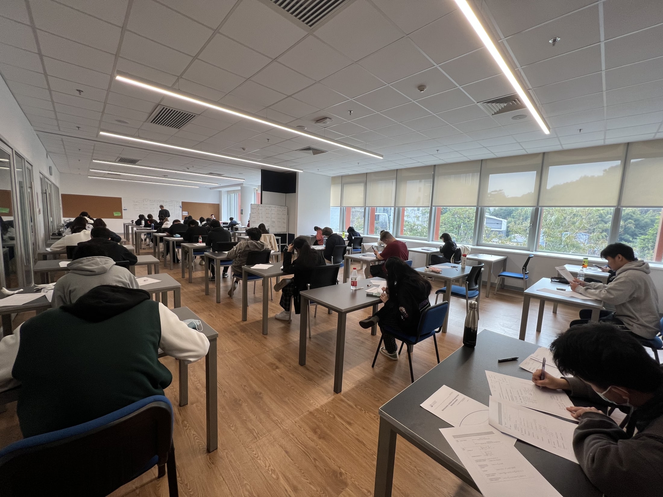 AISG students taking a mock IB exam in AISG classroom (back view)