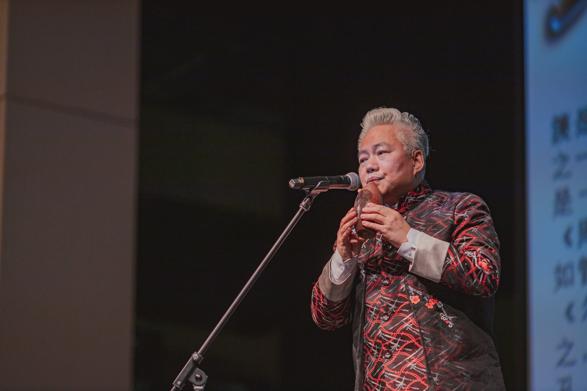 AISG Speaker Series with Fang Jinlong playing a traditional Chinese instrument 
