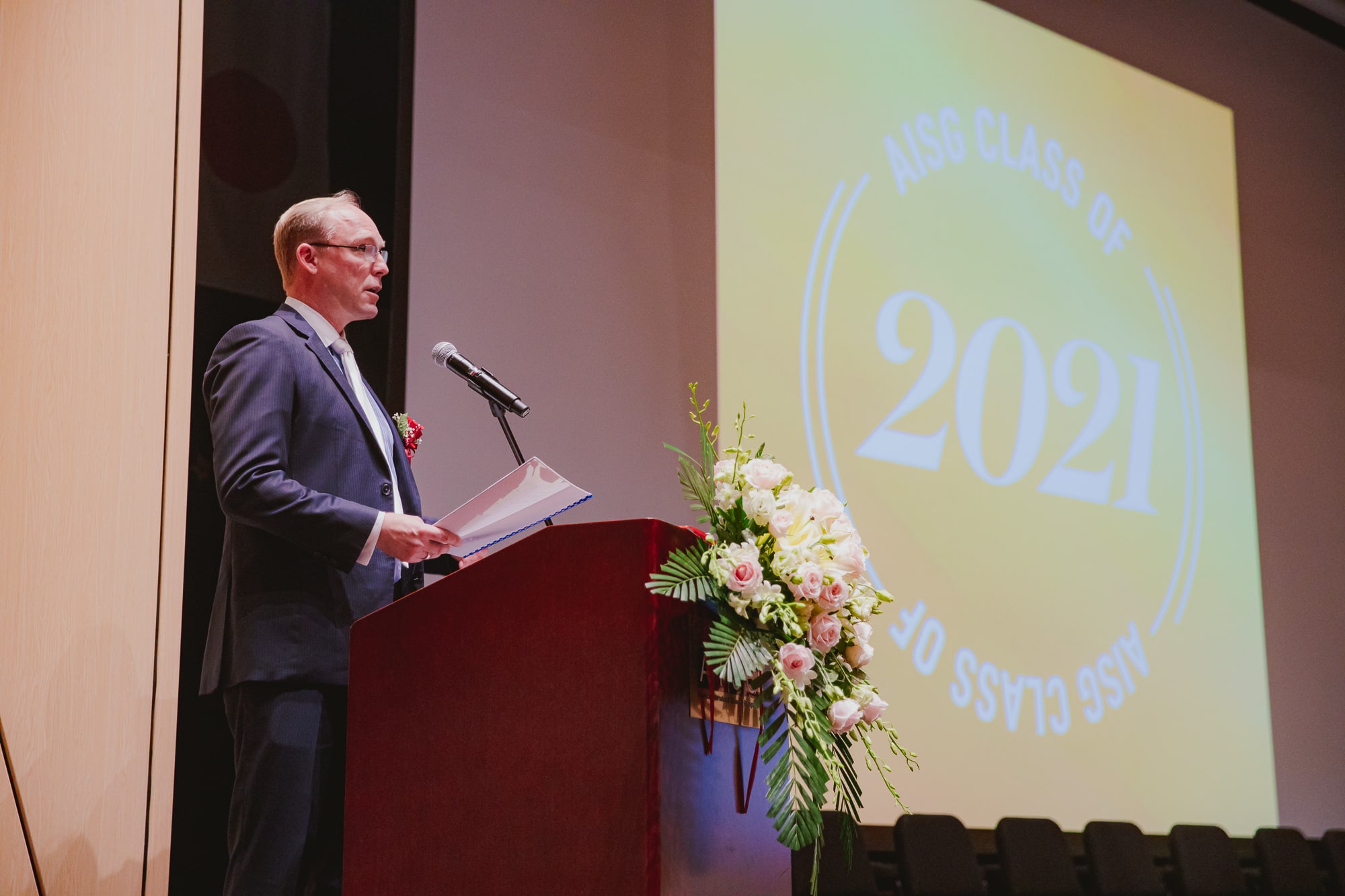 man giving speech on stage