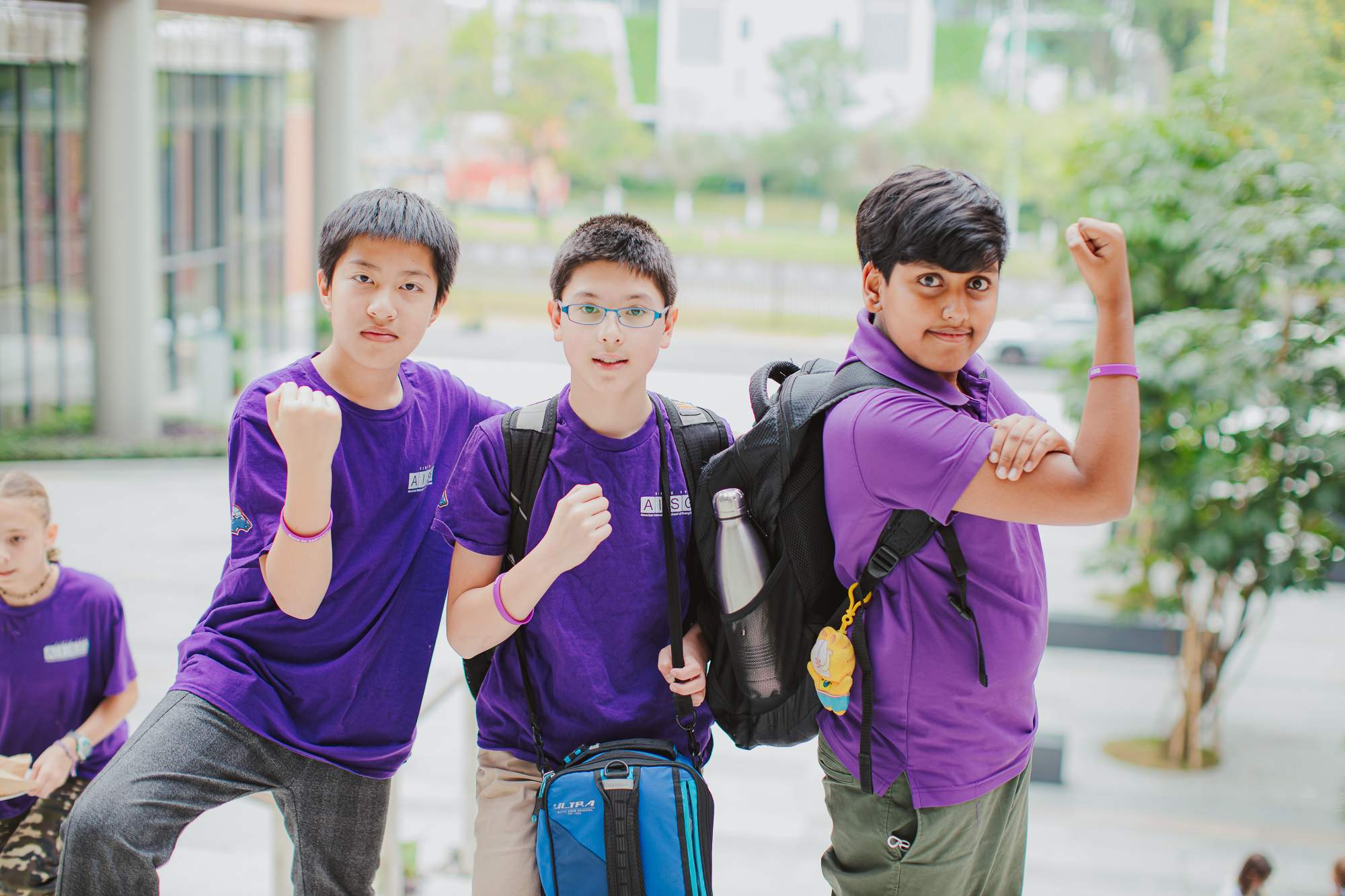 Secondary male students wearing purple for AISG Child Protection Awareness Month