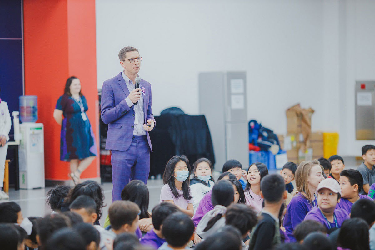 a man is talking to students about keeping safe