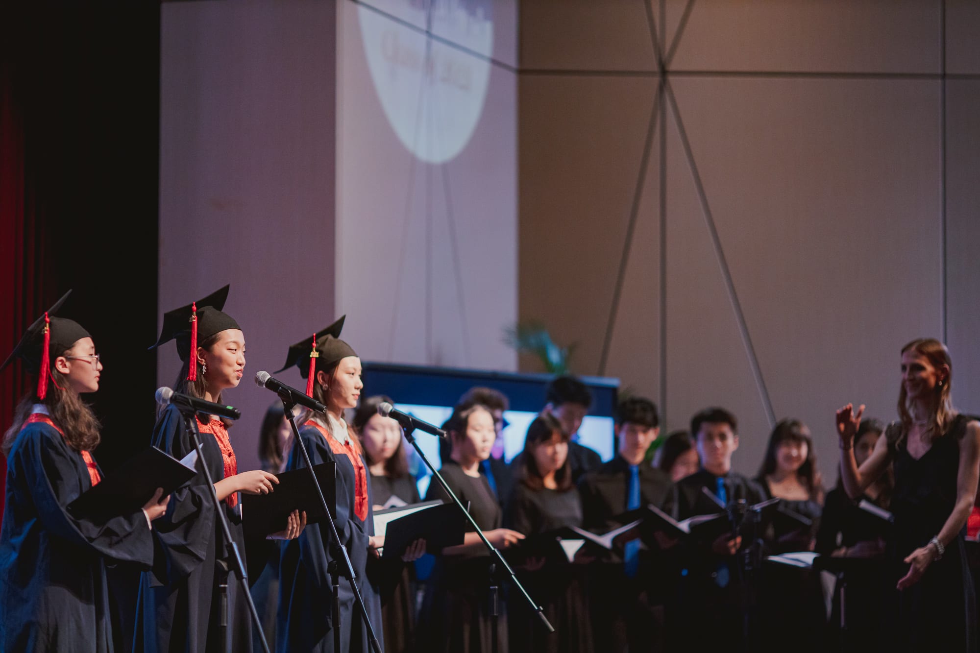 graduates performing solos in choir