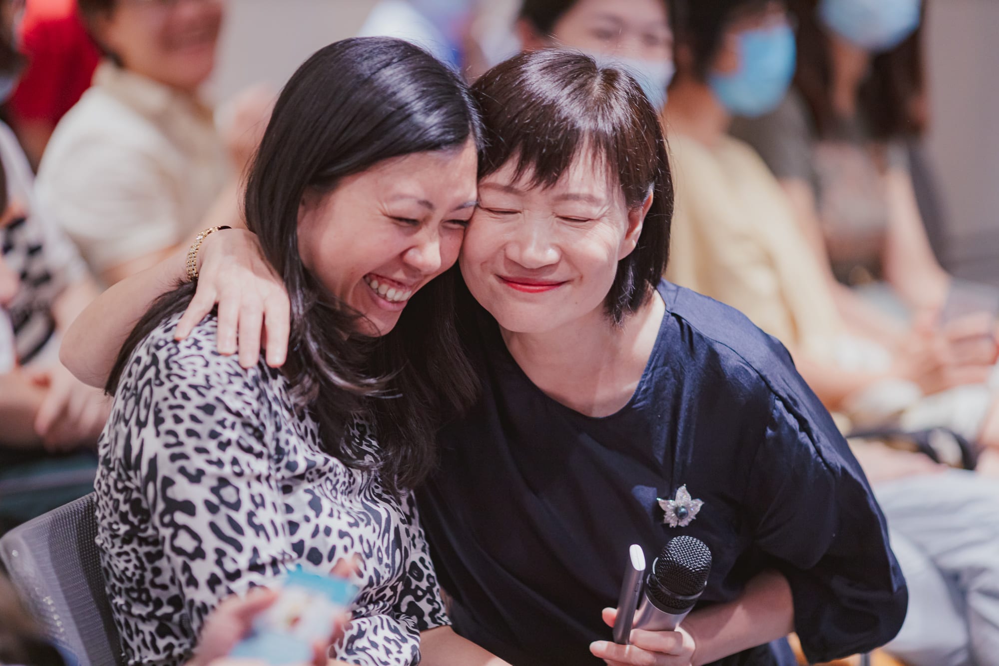 two women hugging and smiling