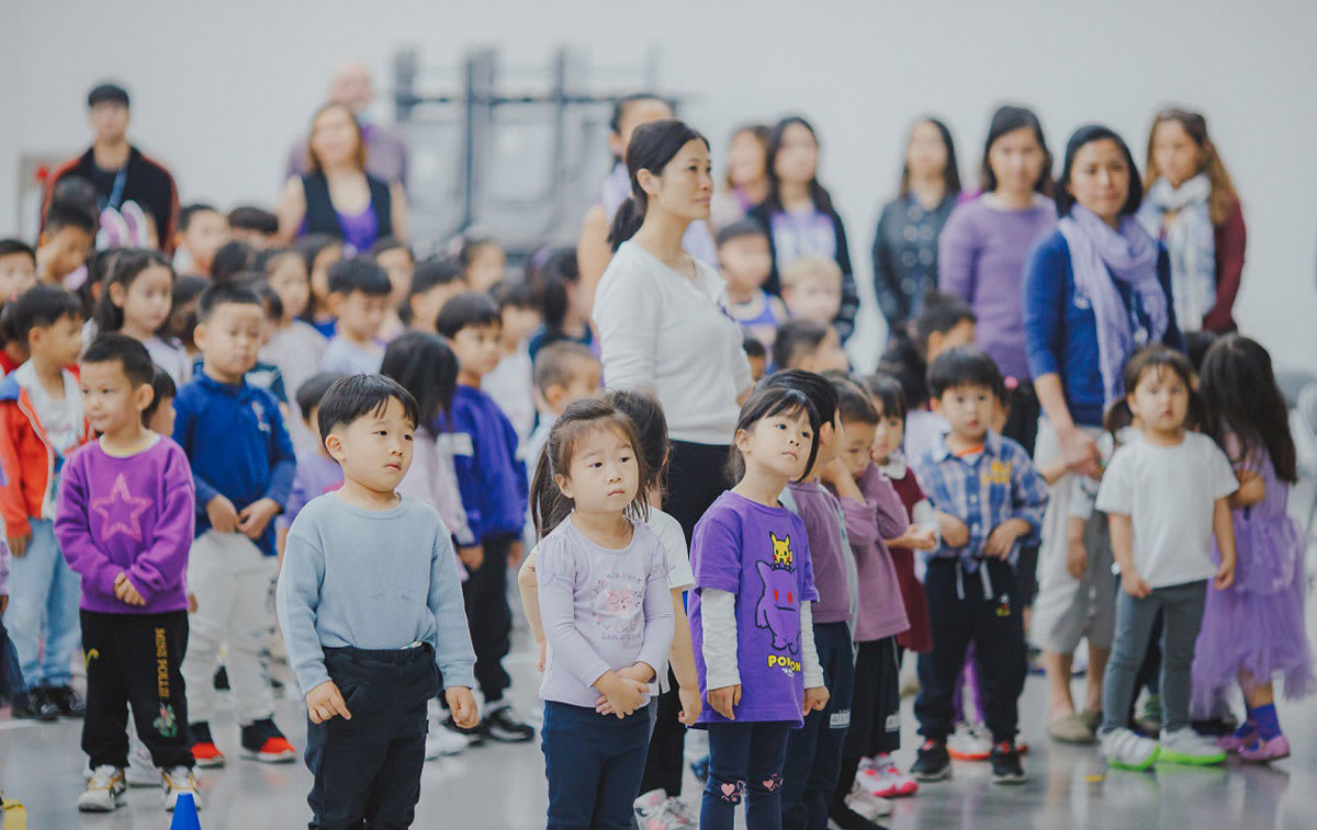 students line up to attend as assembly at school