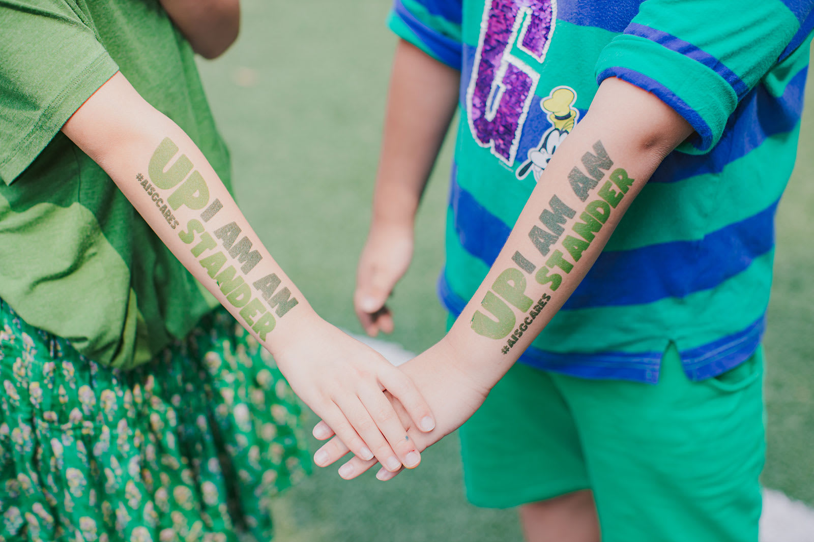 AISG Upstander Awareness Month Hands Together