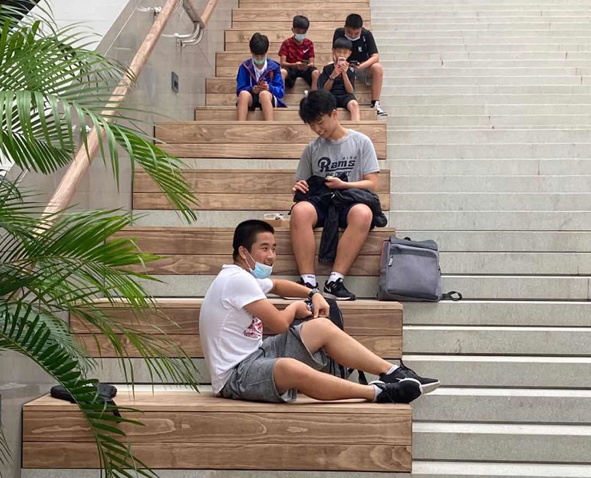 picture of students sitting on the grand staircase in Science Park