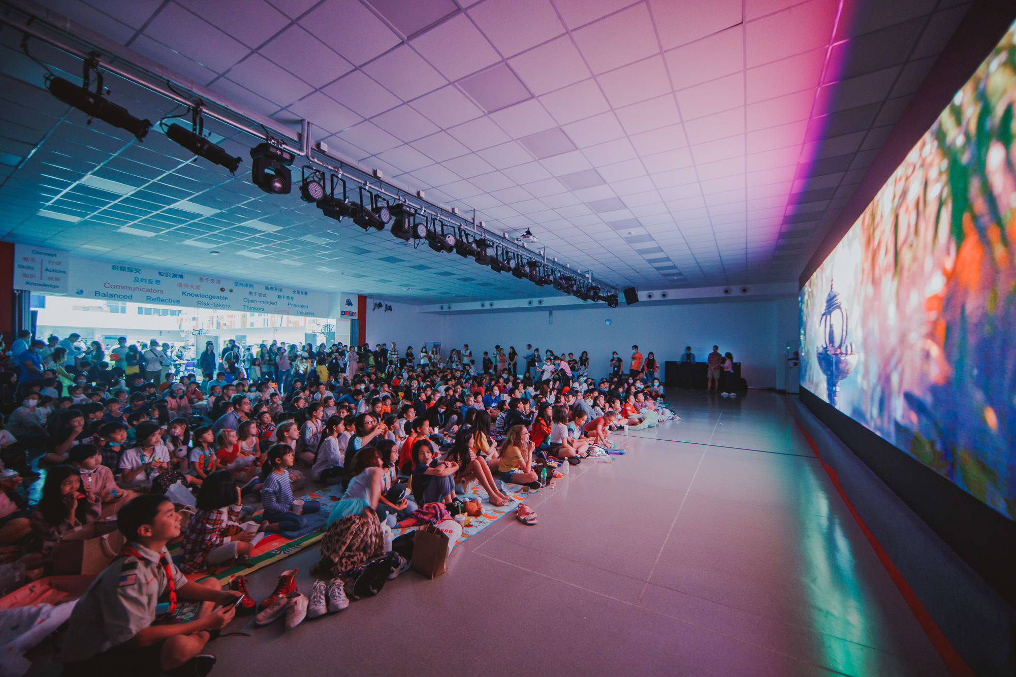 AISG Family Fun Day for SY2122 with elementary and secondary students watching a movie together